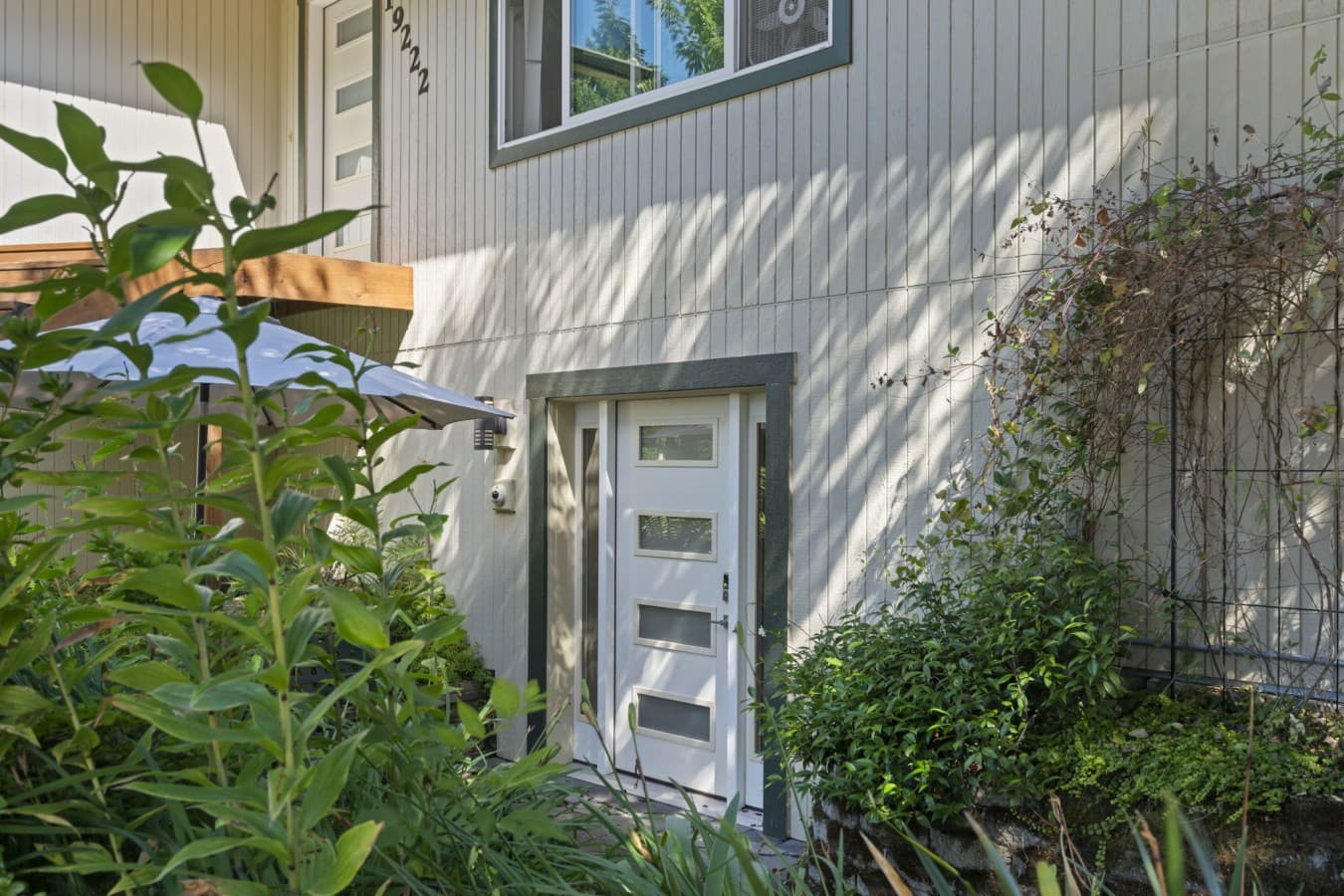 Welcoming private entrance surrounded by established plants and natural shade_(1).jpg