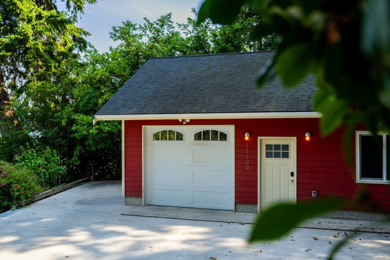 Private garage and convenient on-site parking surrounded by lush greenery for an easy arrival and departure.