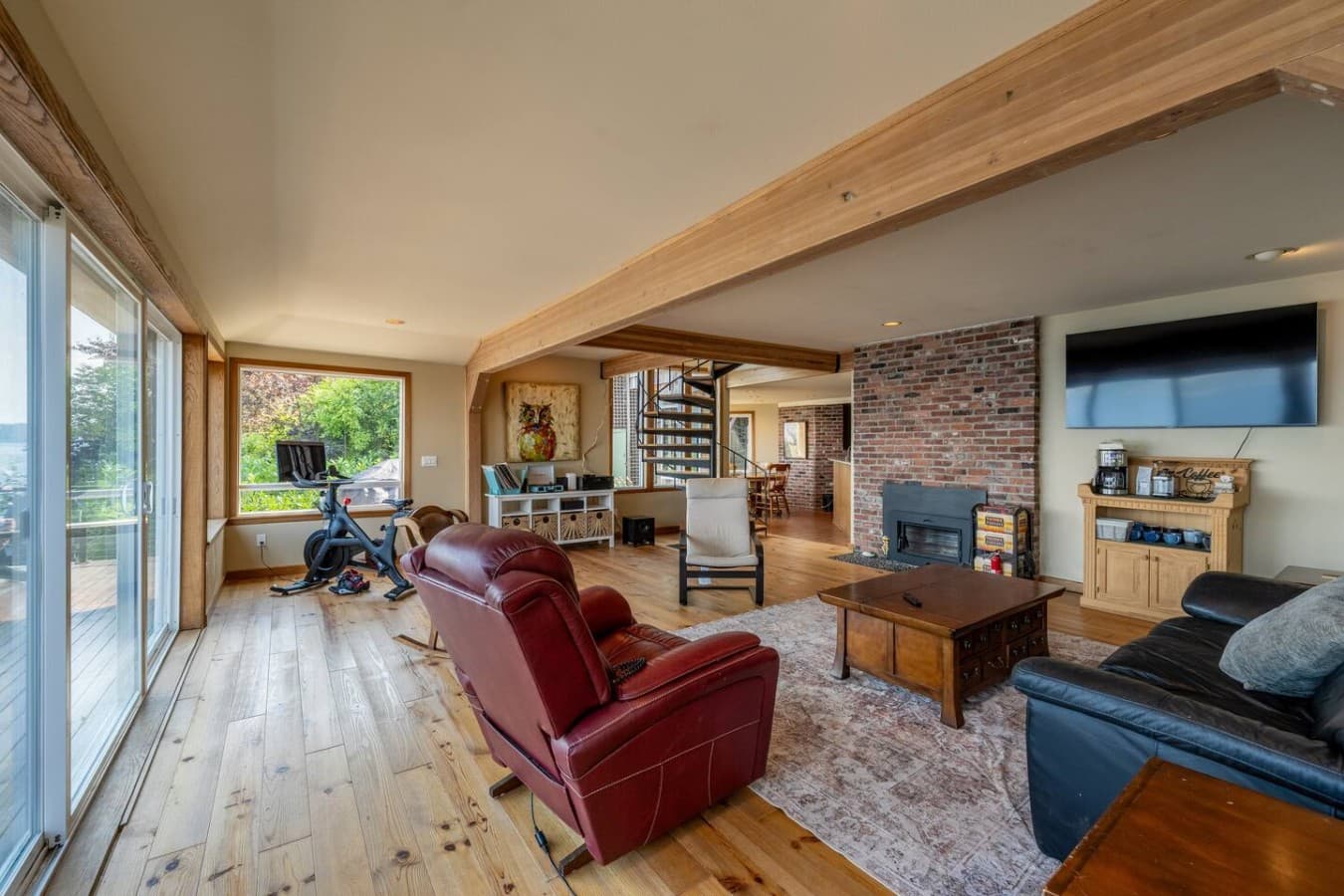 From the spiral staircase to the waterfront windows, this is a space designed for relaxing and staying awhile.