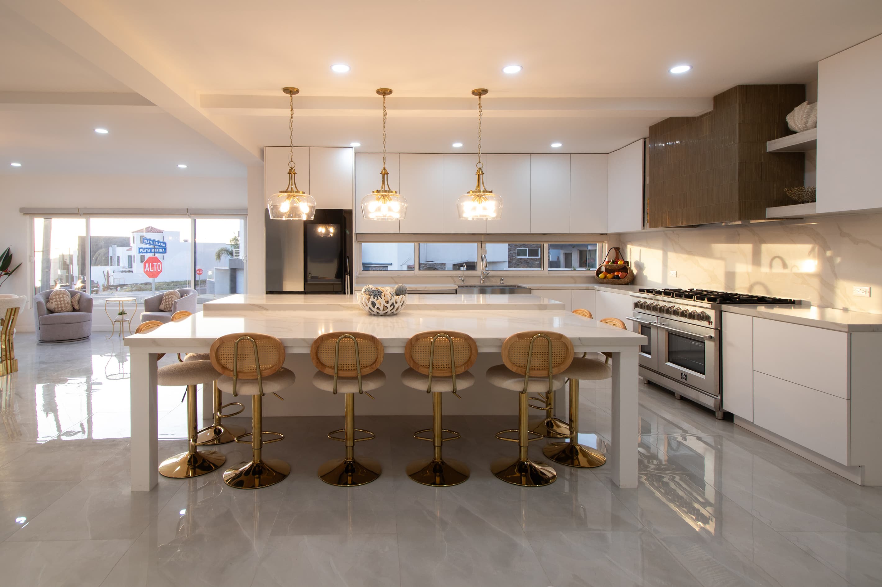 Chef’s kitchen with 48" Italian dual oven professional gas range and large island with seating for 8