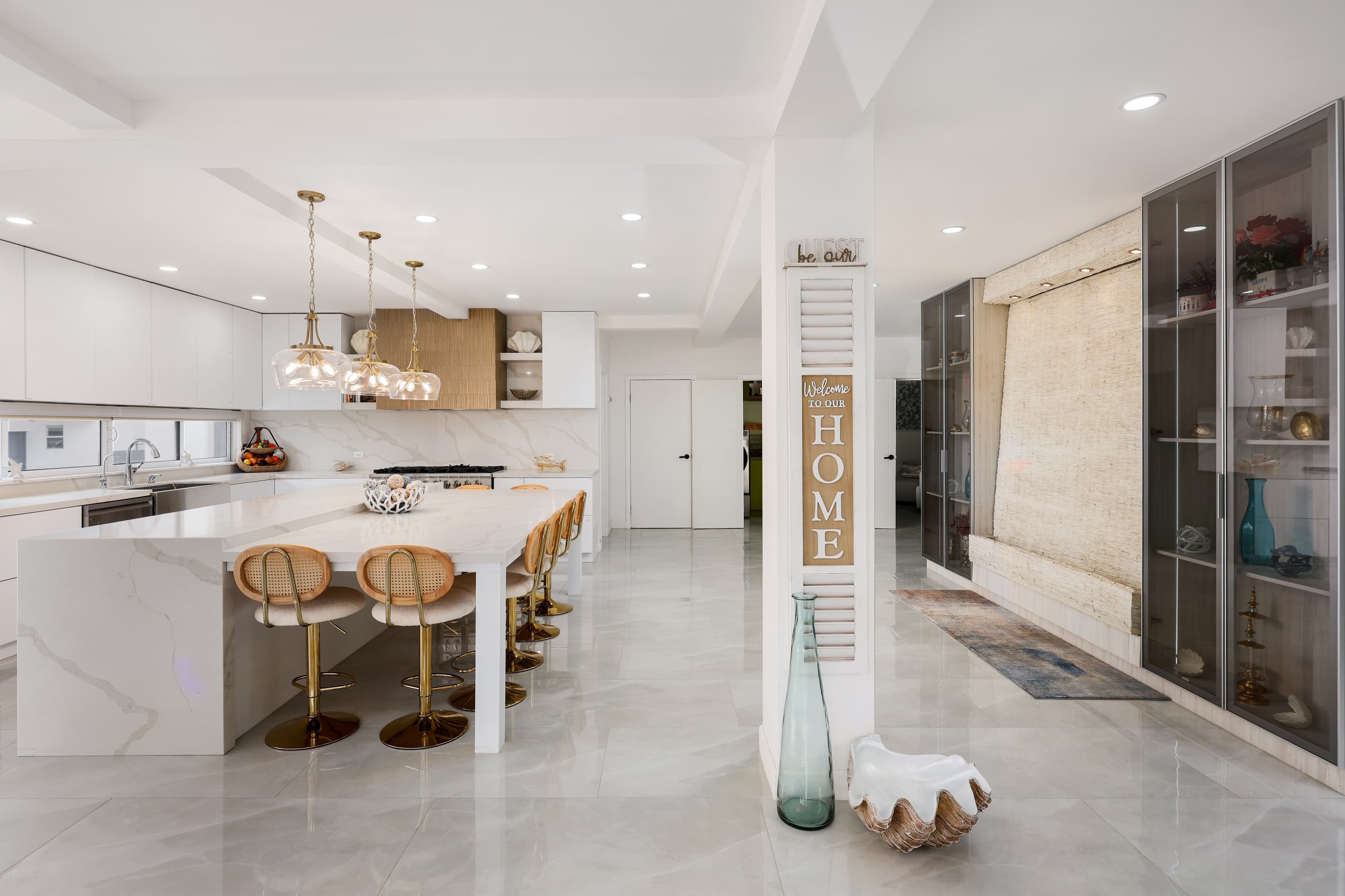 Bright, open-concept chef’s kitchen flows seamlessly into the main living spaces