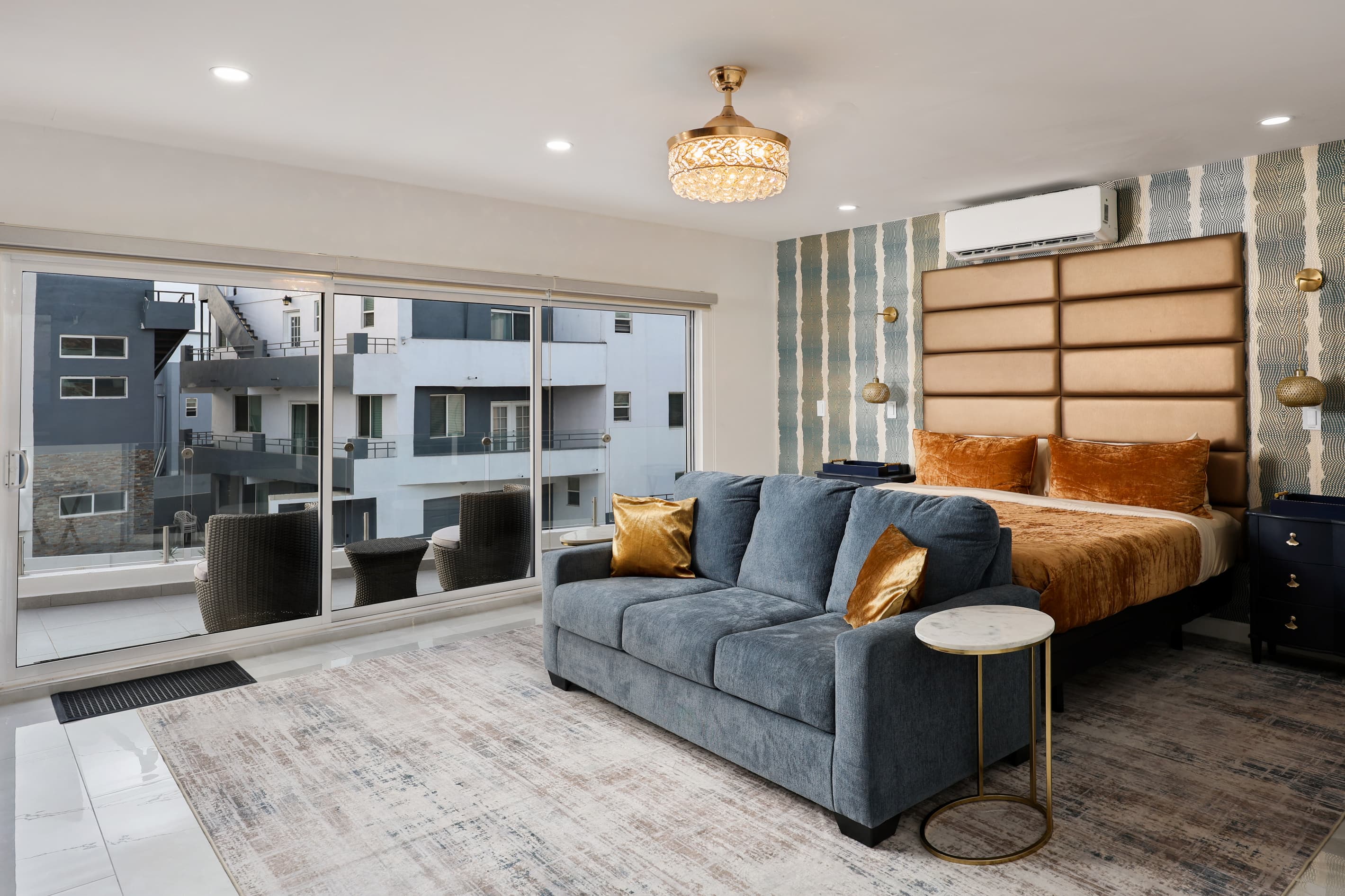 Spacious primary suite with split-King bed on second floor, sitting area, desk & Smart TV