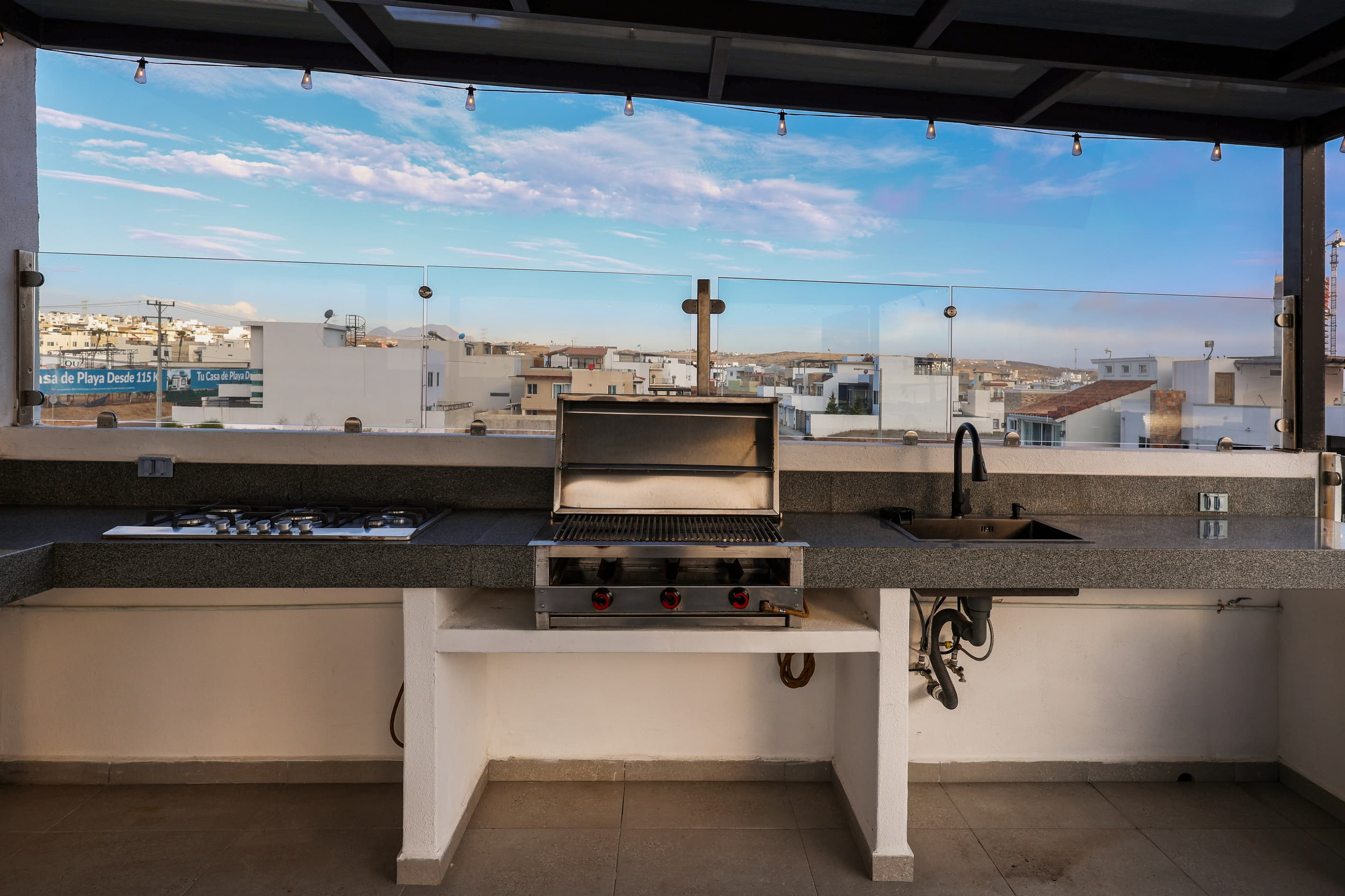 Outdoor kitchen & grill make rooftop meals easy while enjoying the Pacific views