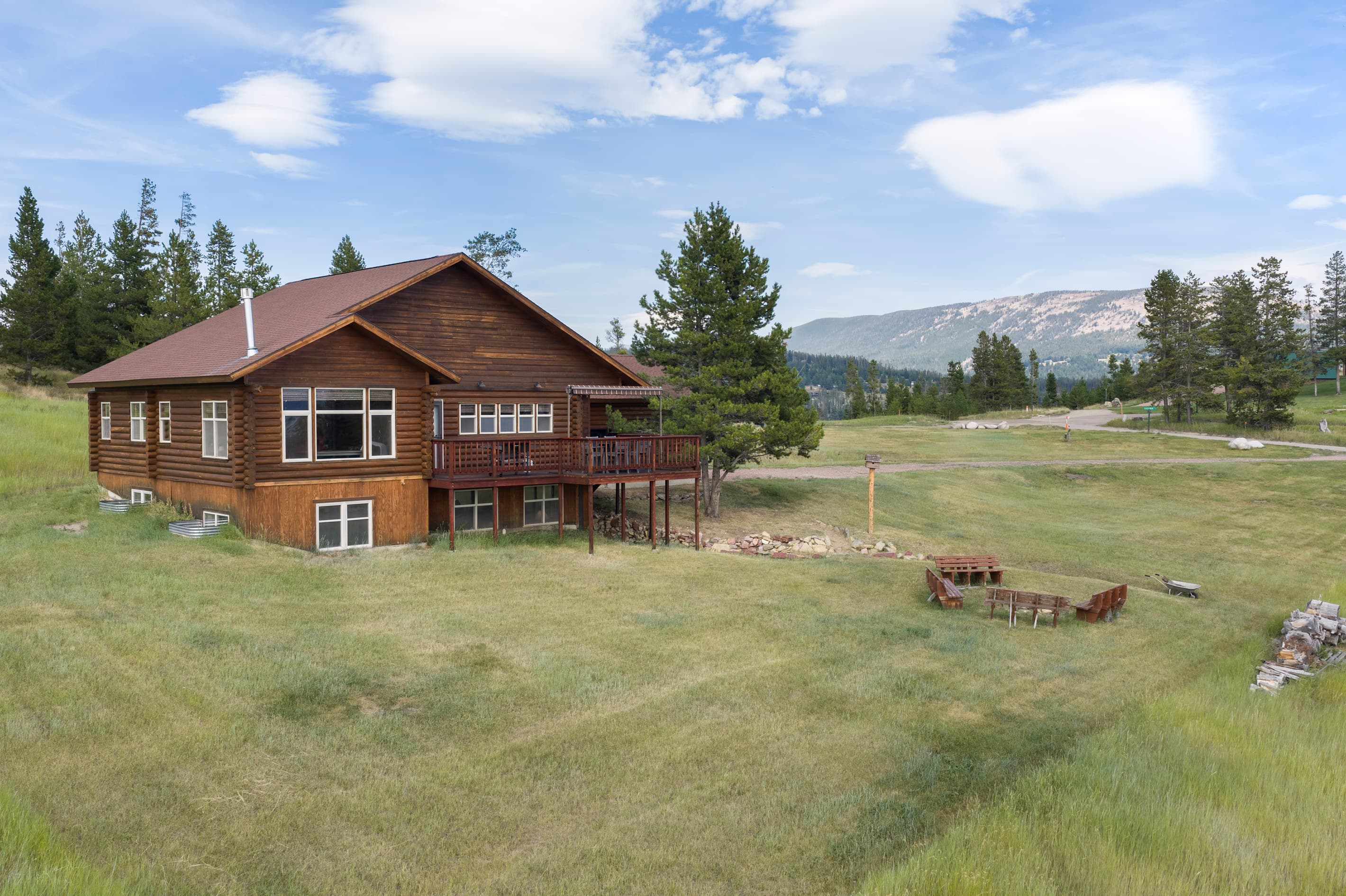Large yard with views of mountains & lake