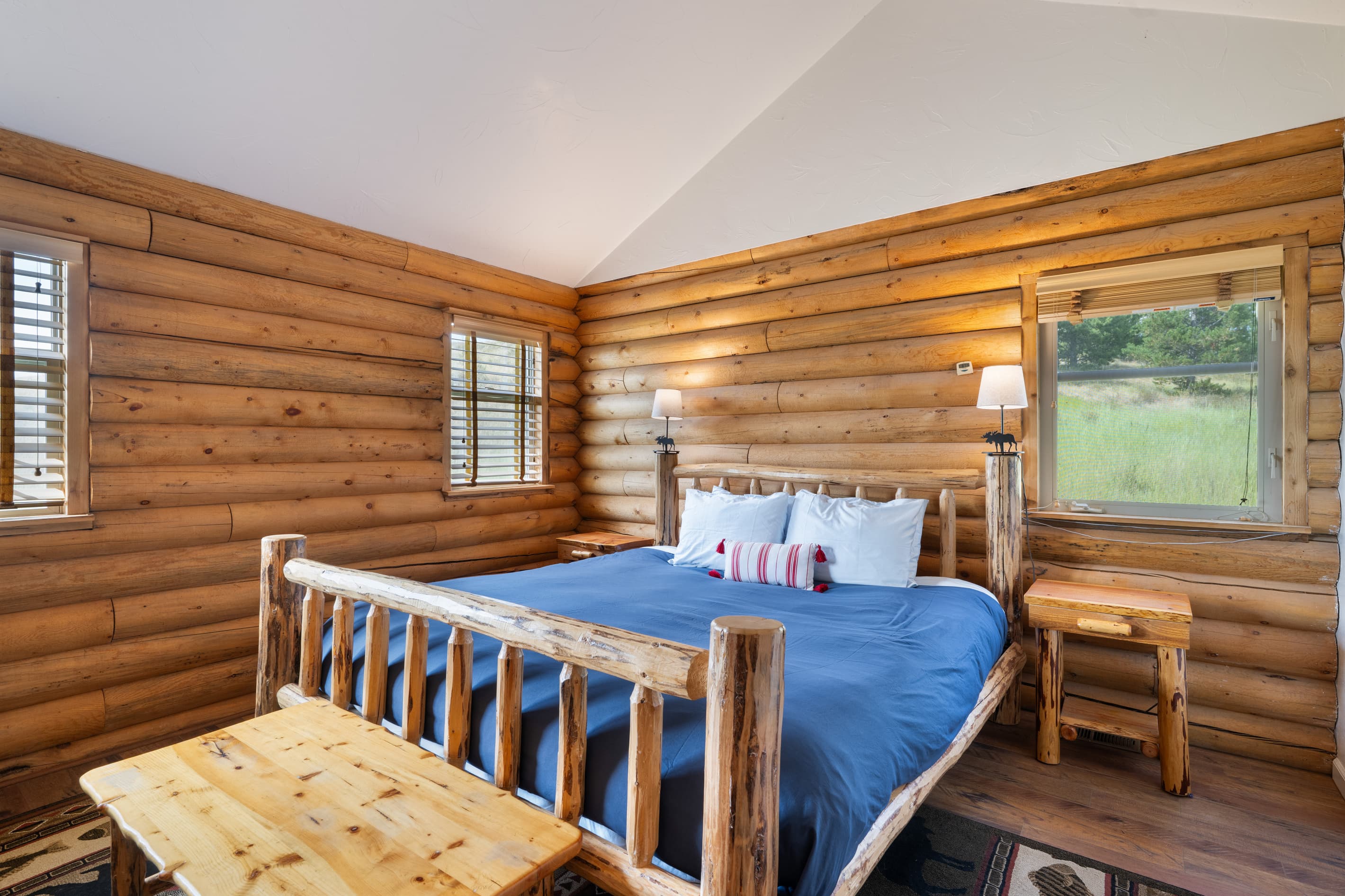 Bedroom 1: Main floor primary suite with King bed & work space.