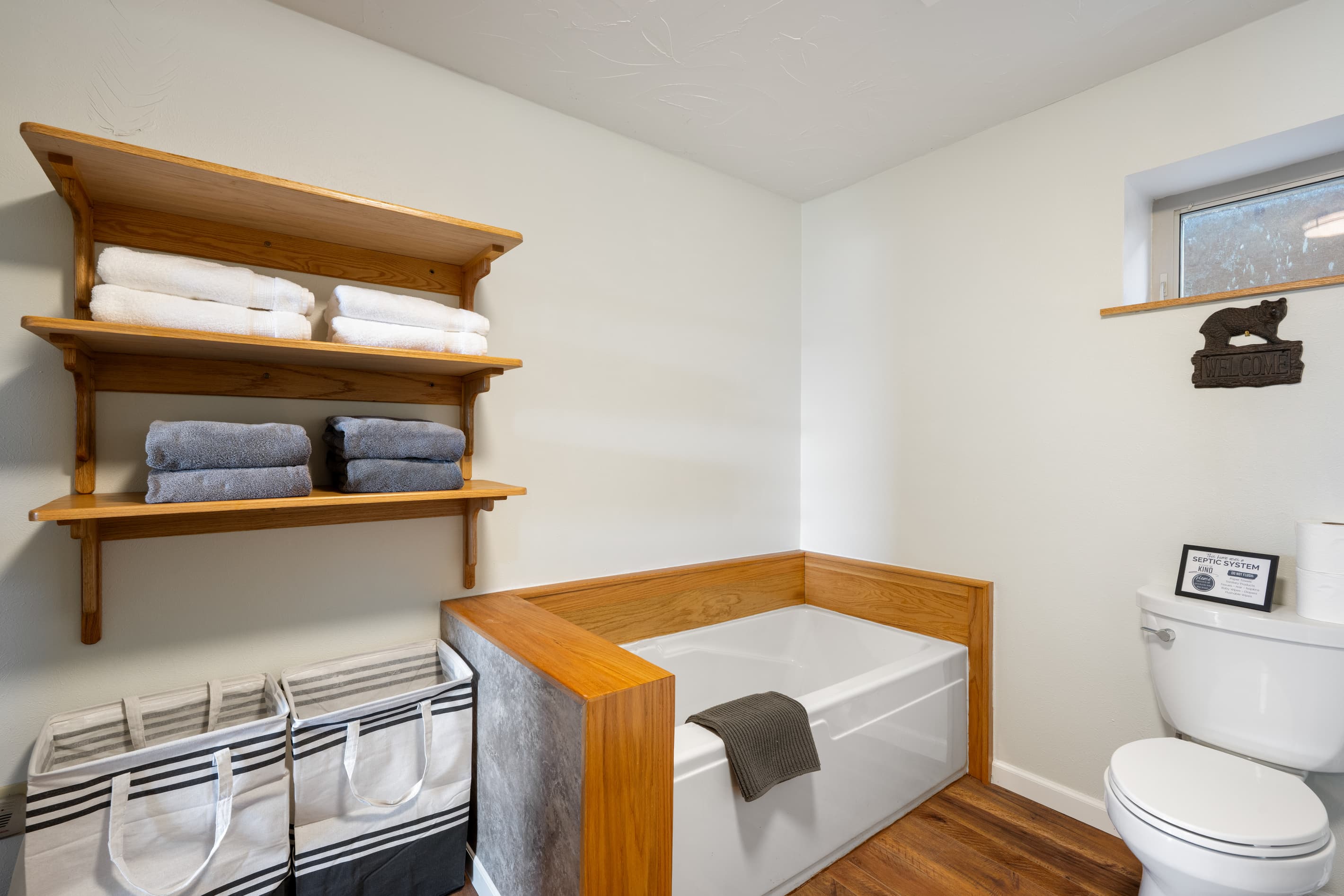 Lower level bathroom with large soaking tub, shower & dual sinks. 