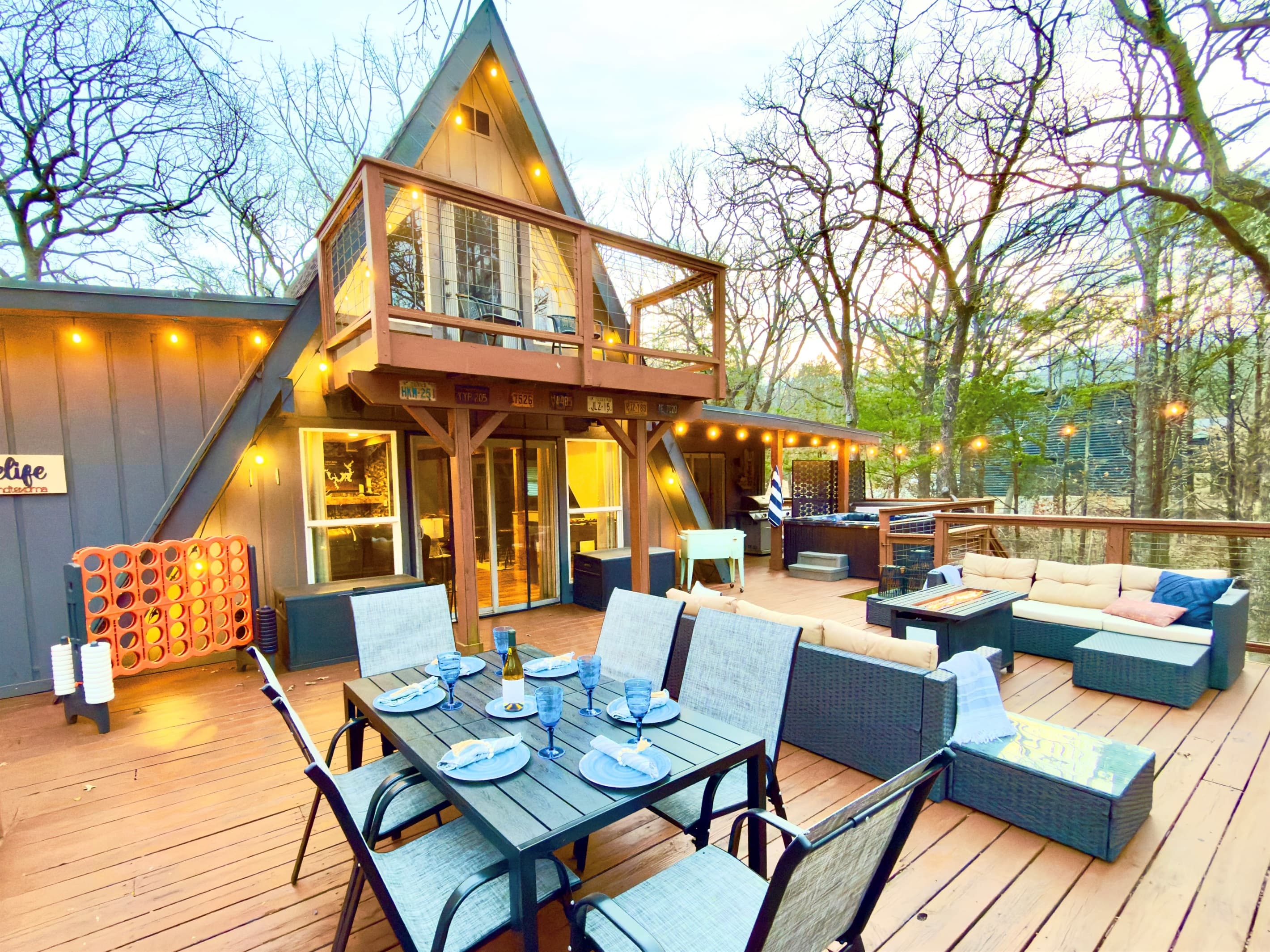 800 sf Deck | Fire table | Outdoor Cooler | Gas Grill (Propane Provided) | Private Hot Tub | Tons of Outdoor Games | Private Wooded Views | String Lights | Outdoor Dining Table for 6
