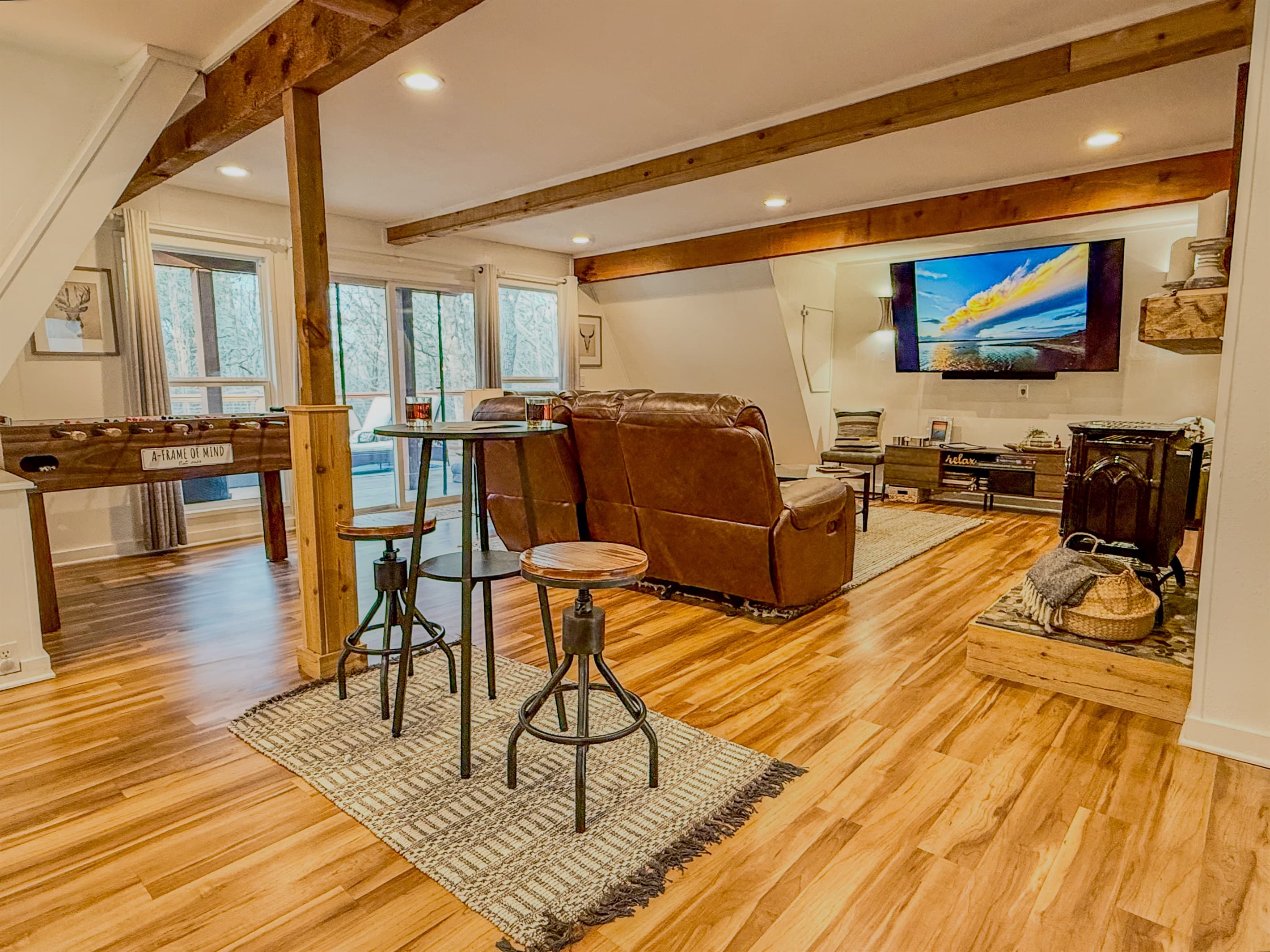 4 Recliners | Foosball Table | 75" Roku TV with Hulu Live TV | Books & Games | Bar Table | Gas Fireplace