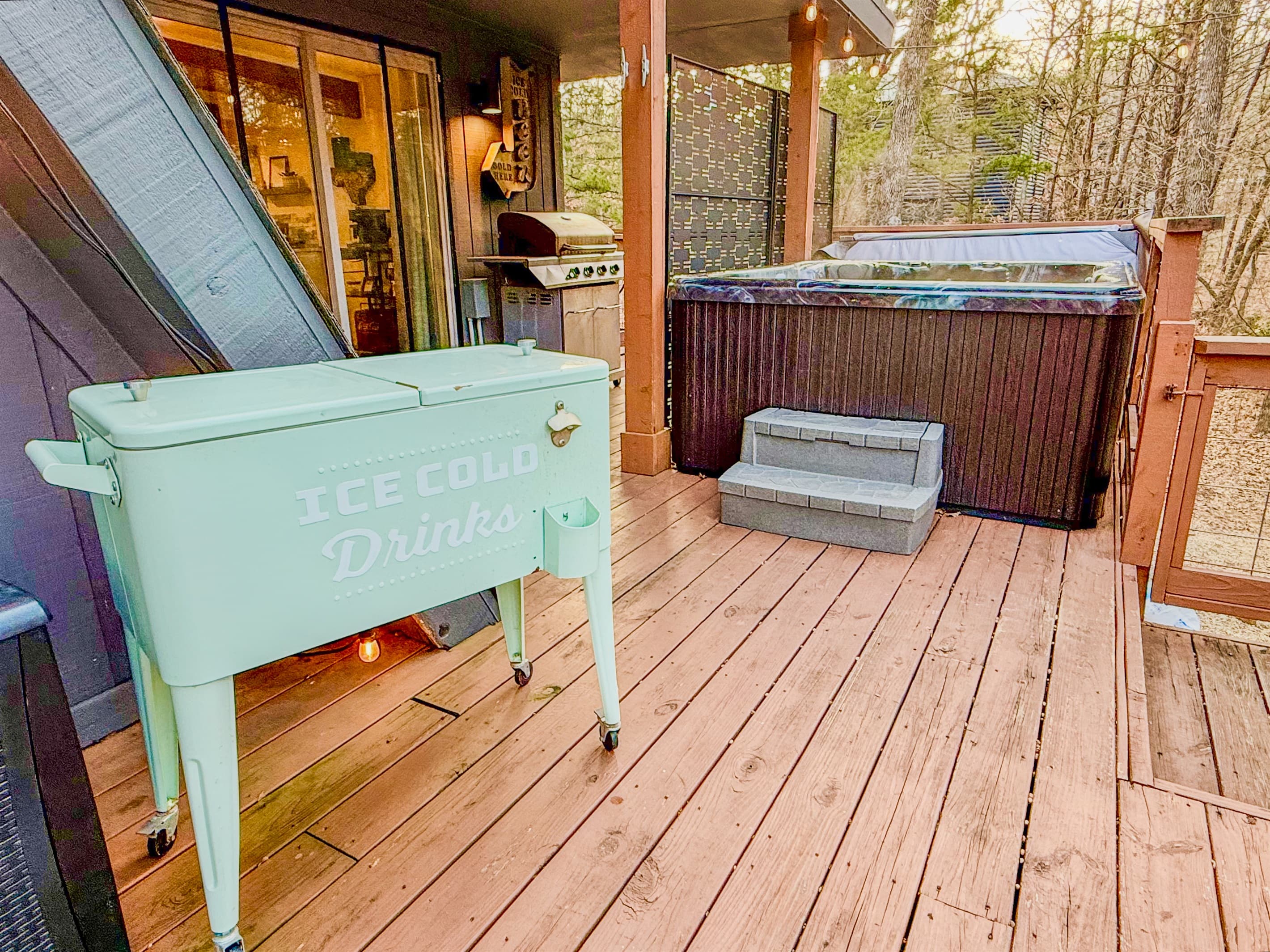 800 sf Deck | Gas Grill (Propane Provided) | Outdoor Cooler | Private Hot Tub for 4 people with Speaker | Private Wooded Views | String Lights