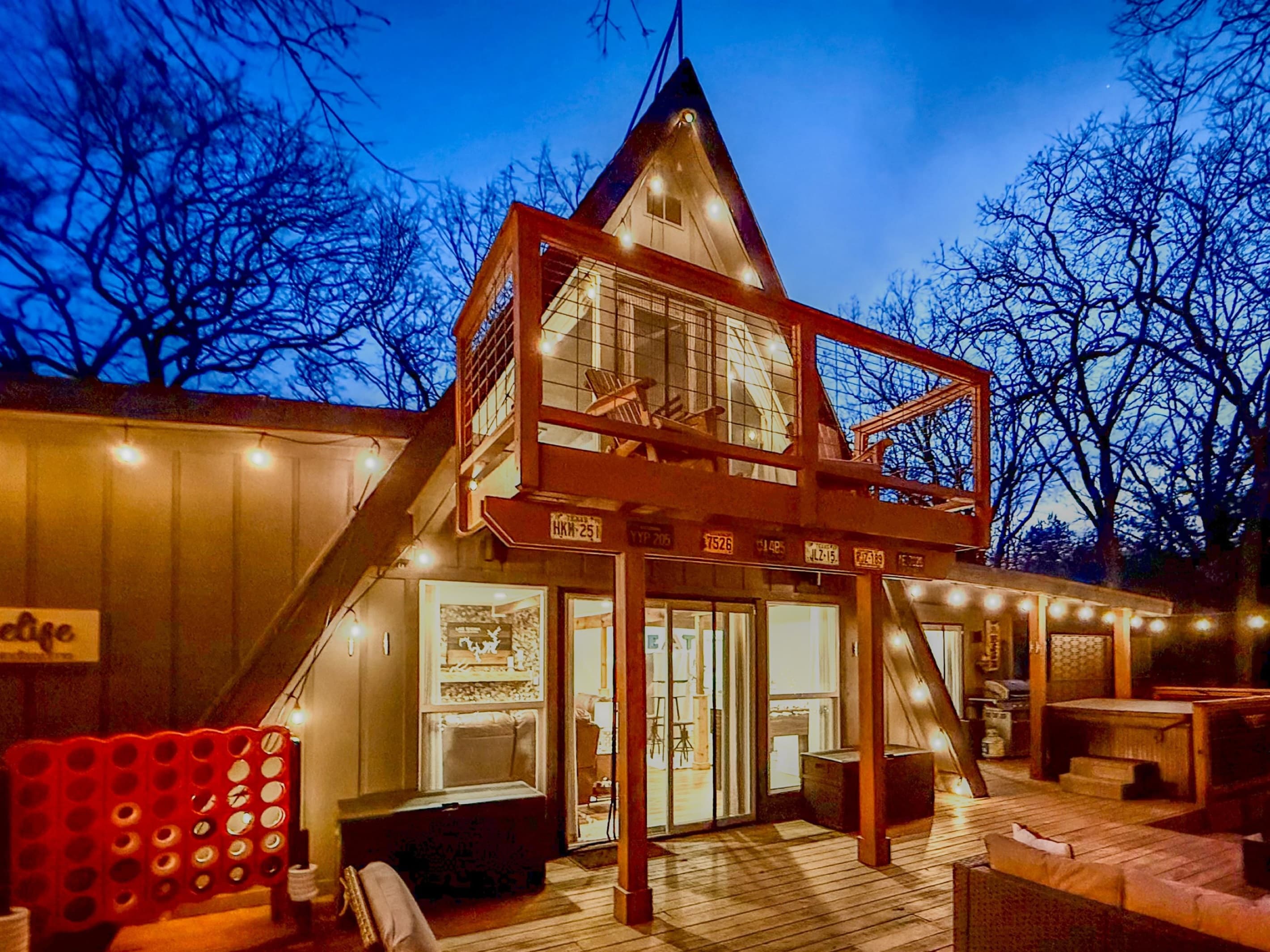 800 sf Deck | Fire Table | Outdoor Cooler | Gas Grill (Propane Provided) | Private Hot Tub | Outdoor Games | Private Wooded Views | String Lights