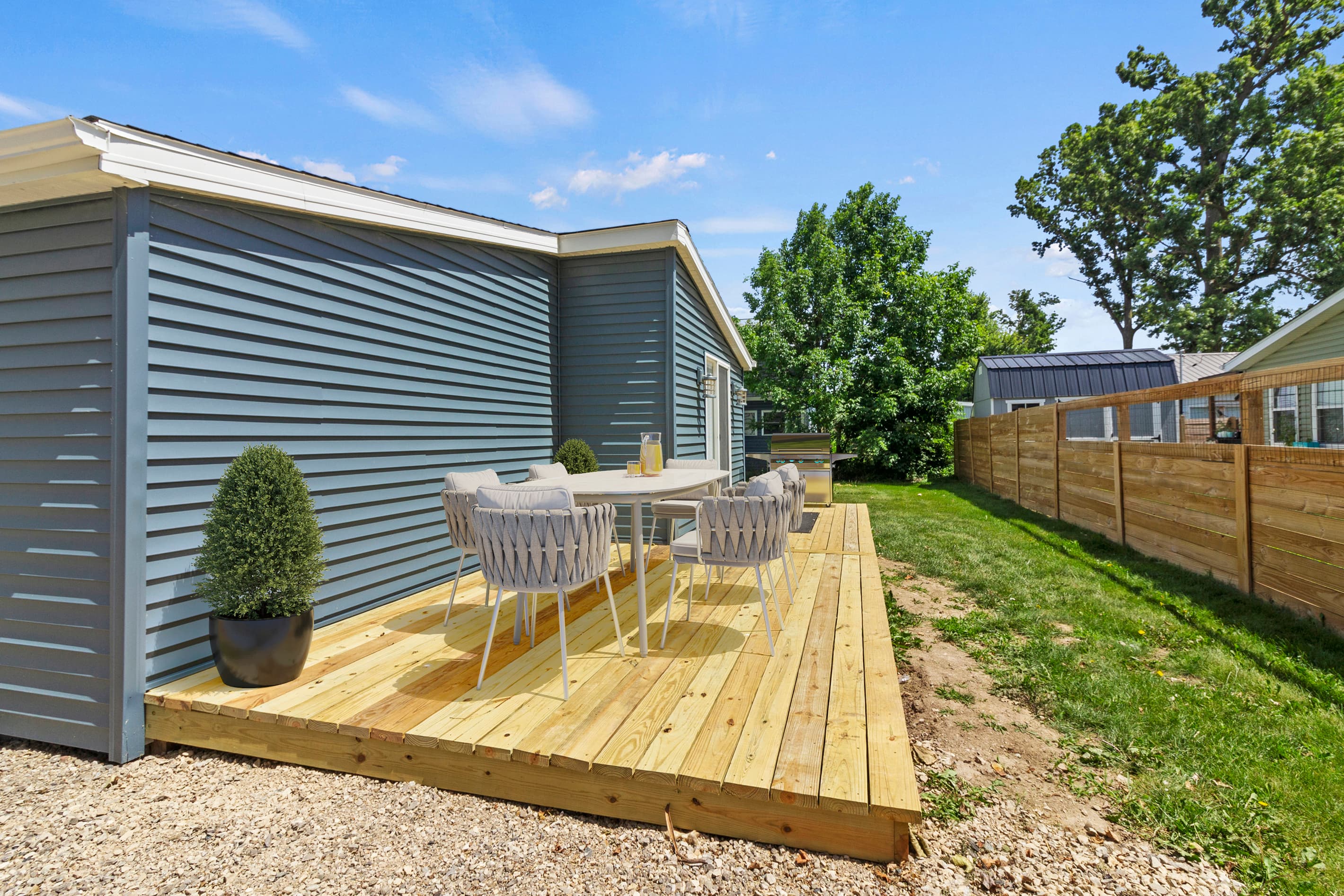 The Waterbury Way - Patio with outdoor dining and Blackstone grill