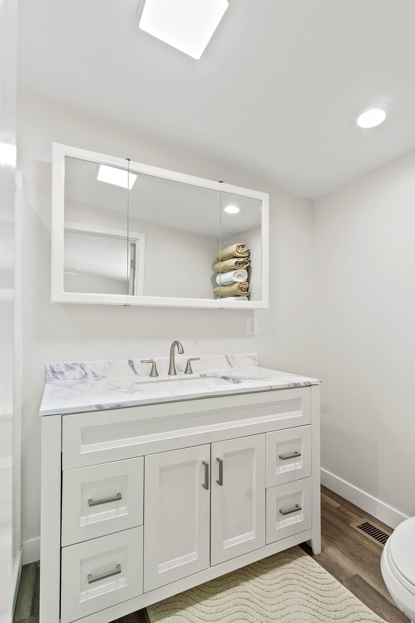 The Waterbury Way - Primary Bath Vanity with hair dryer, make-up mirror and make-up remover wipes