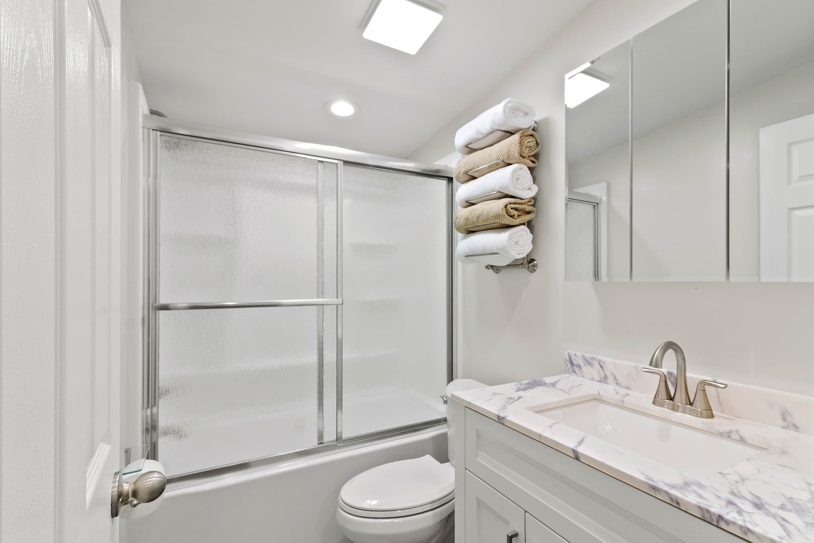The Waterbury Way - Secondary Bath with tub/shower combo and rainfall shower door
