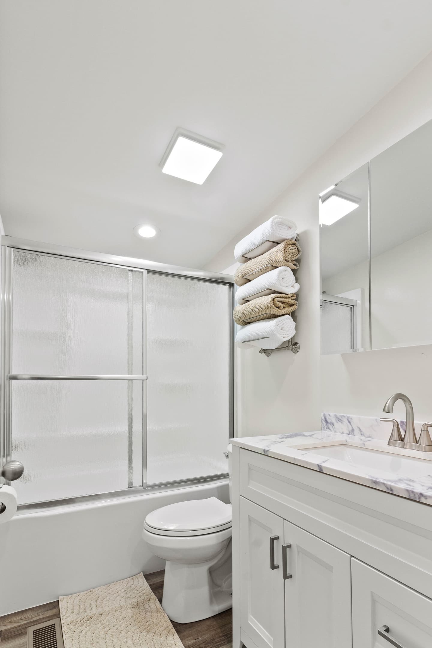 The Waterbury Way - Secondary Bath with vanity cabinet, vanity with hair dryer, make-up mirror and make-up removal wipes