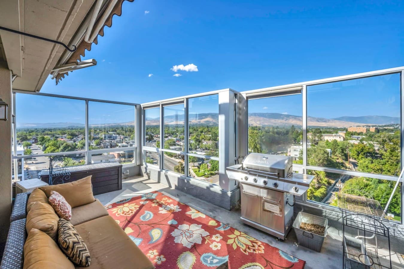 Outdoor lounging, grilling, and panoramic mountain views.