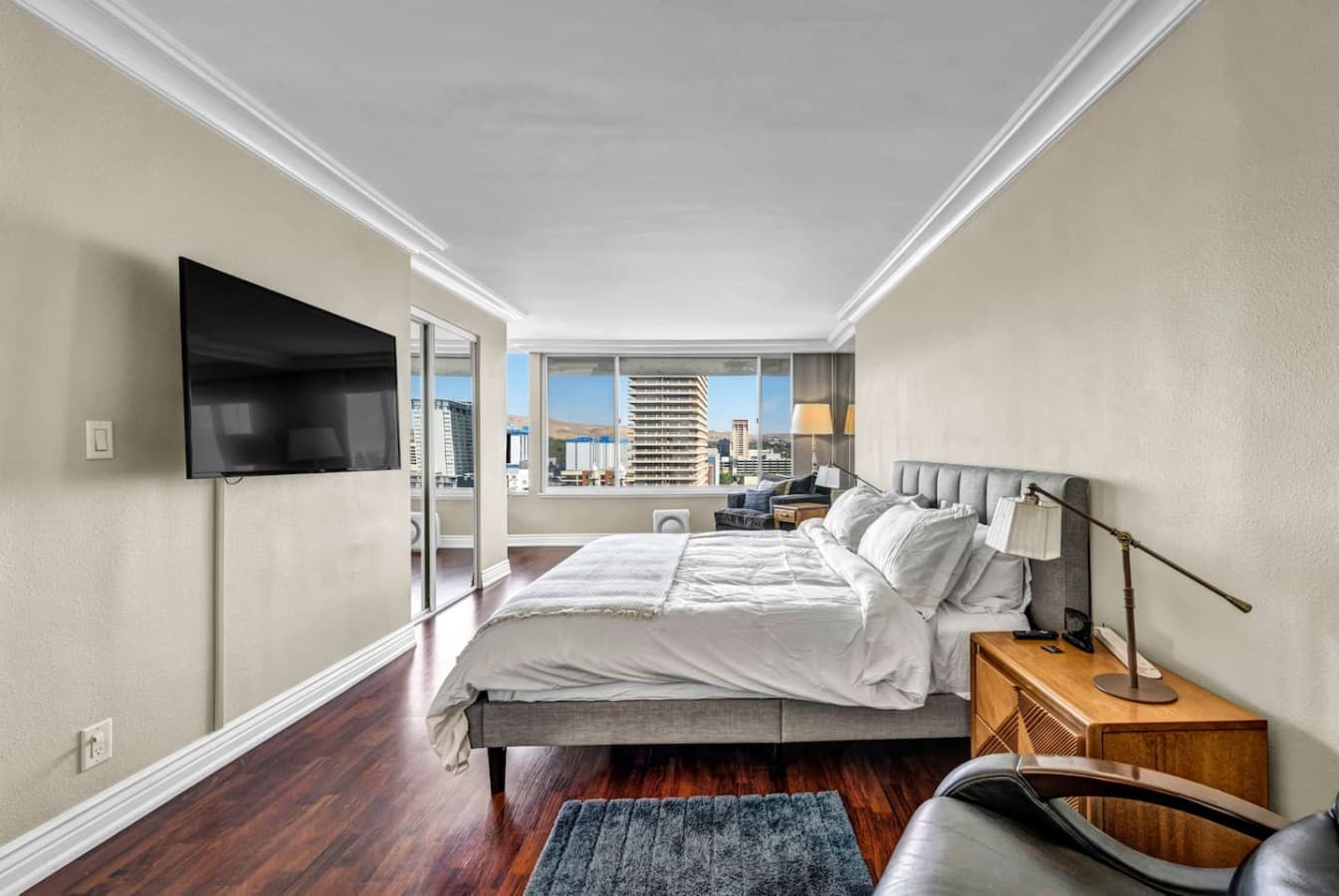 A comfortable king retreat with city views right outside the window.