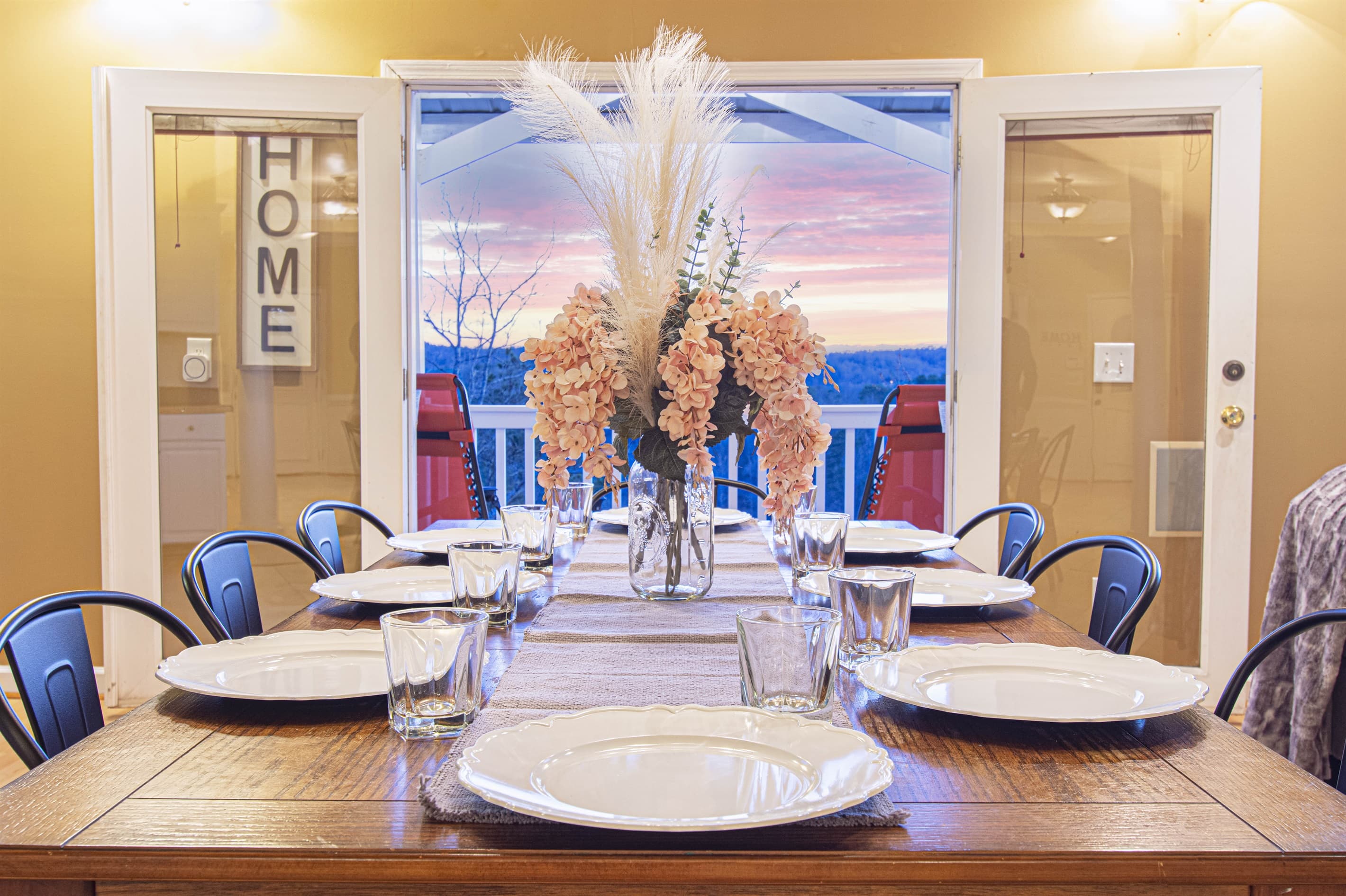Dining Room: Gather around the stylish table and enjoy breathtaking sunset views!