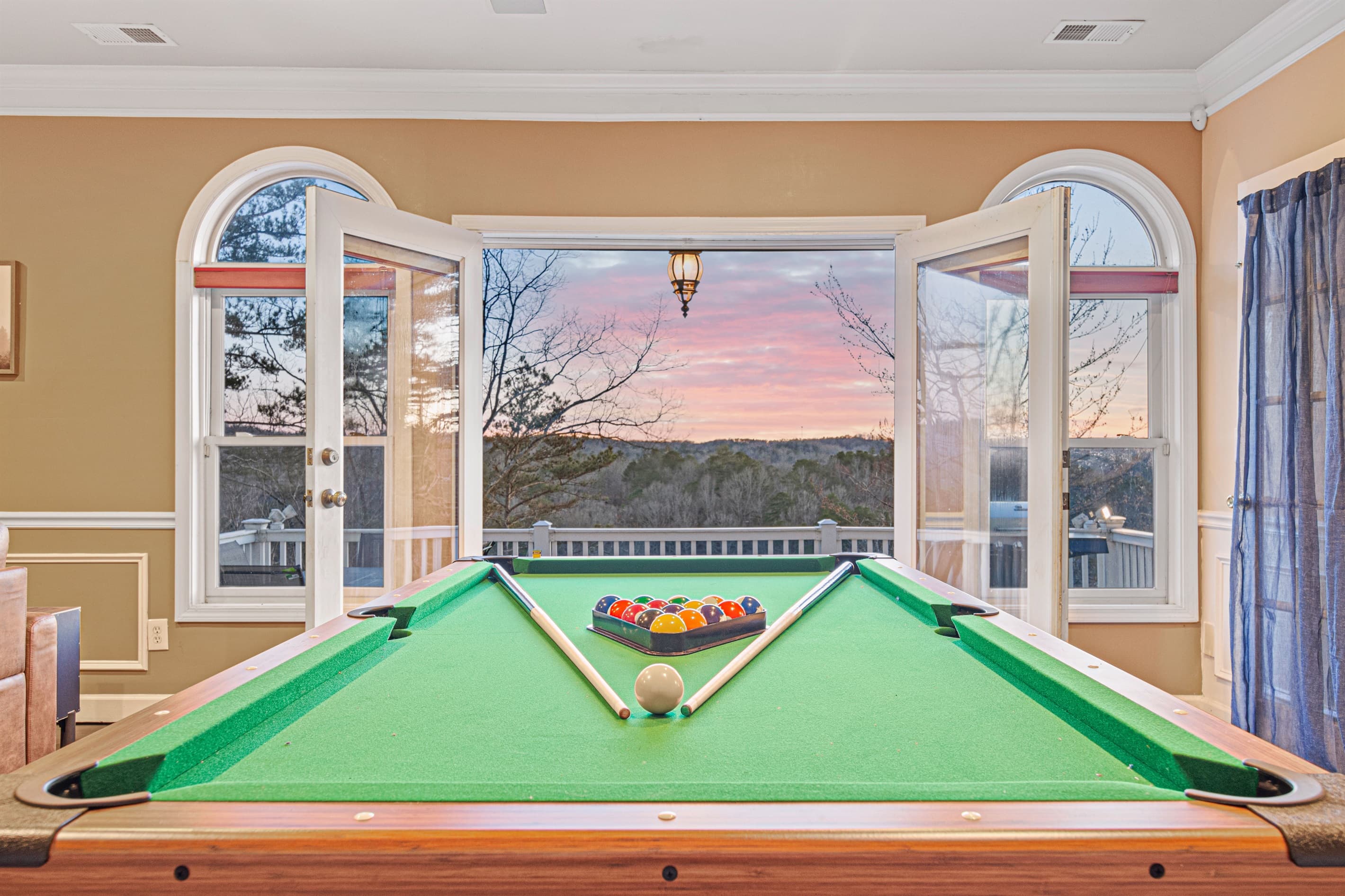Game Room: Rack up fun with stunning sunset views as you challenge friends to a match!