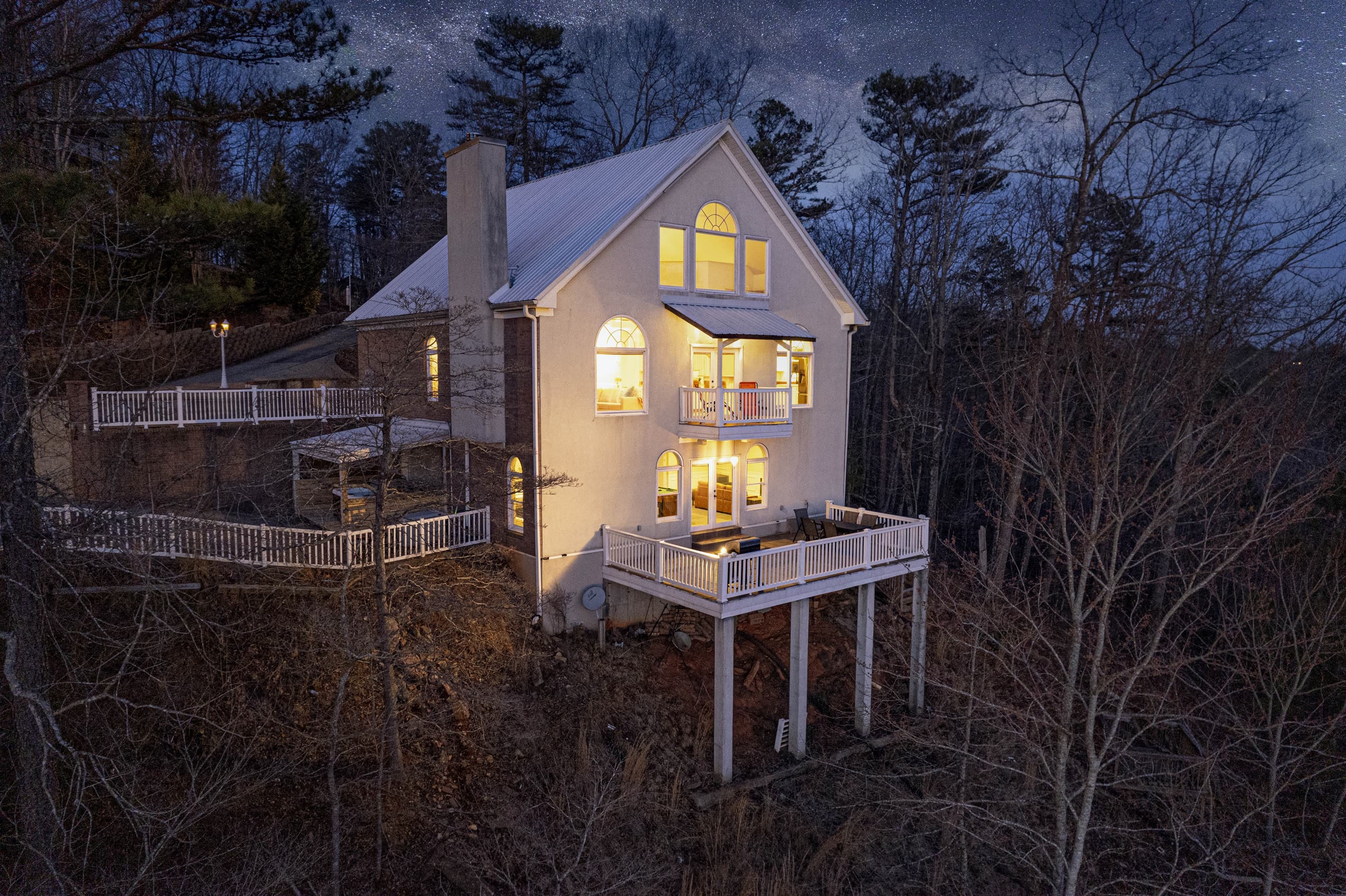 Exterior Retreat: Elevated deck with stunning views, perfect for evening relaxation under the stars!