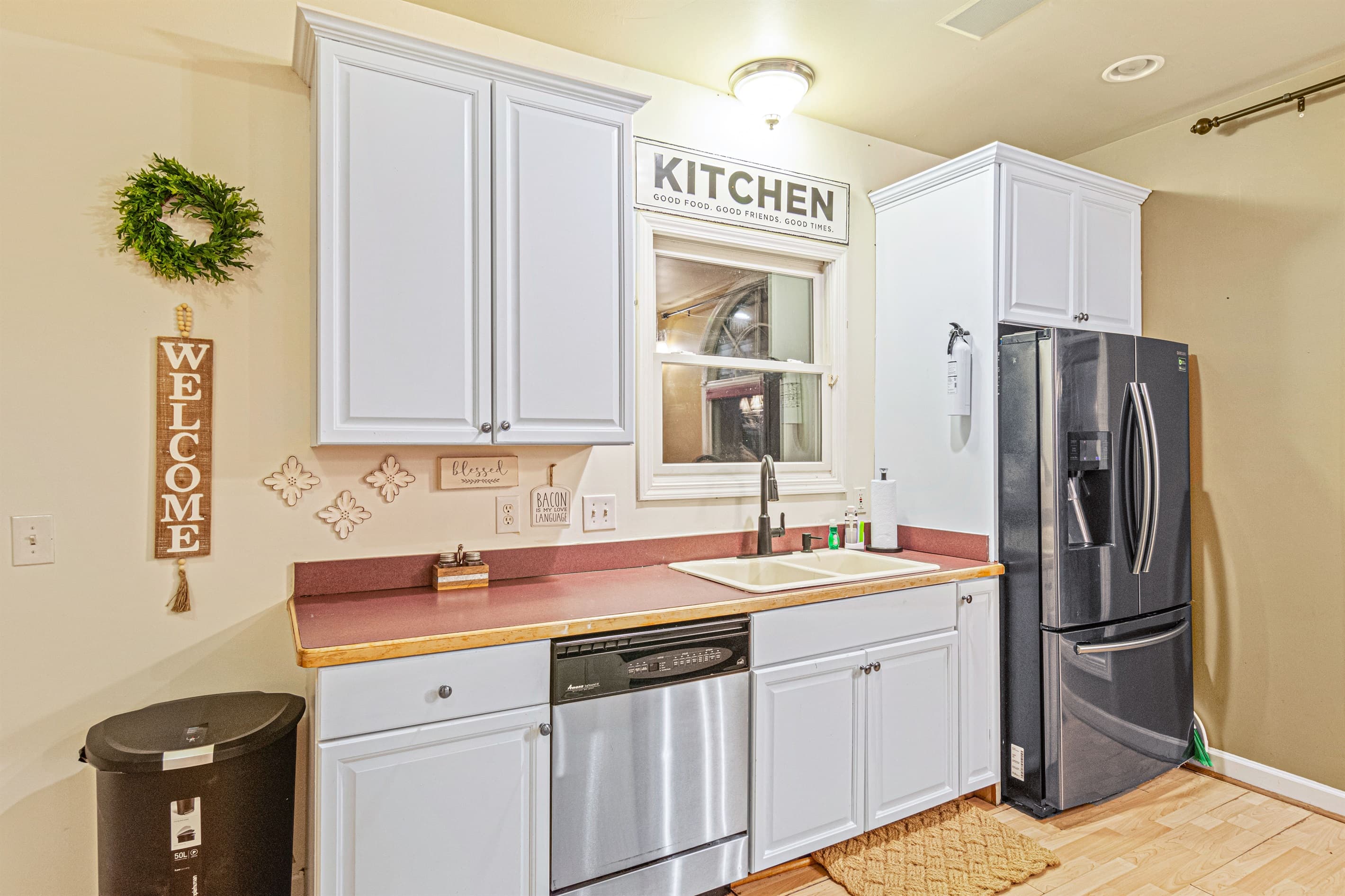 Charming Kitchen: Cook delightful meals in a bright space featuring modern appliances and homey decor!