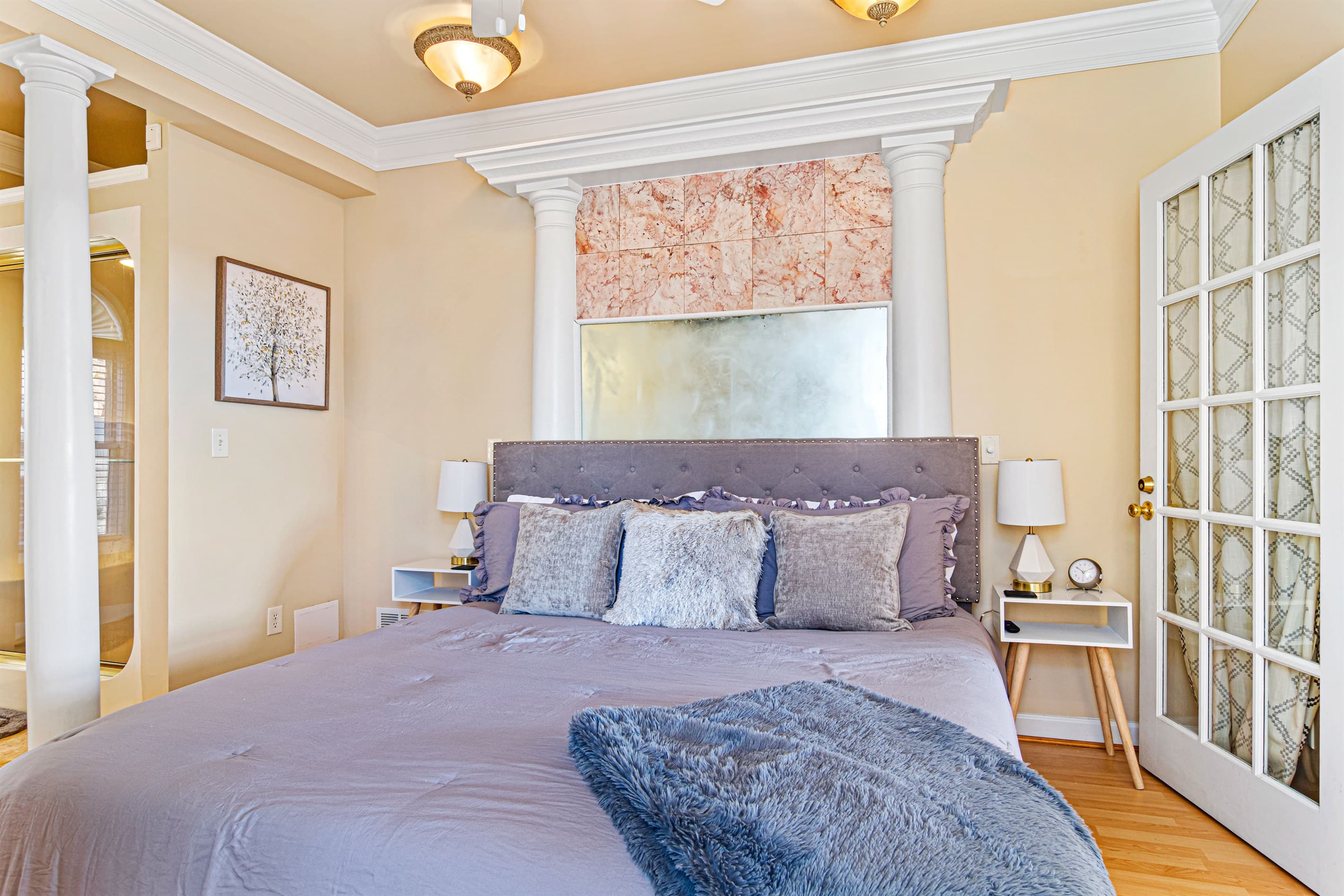 Main Bedroom: Elegant retreat with plush bedding, chic decor, and serene light-filled ambiance!