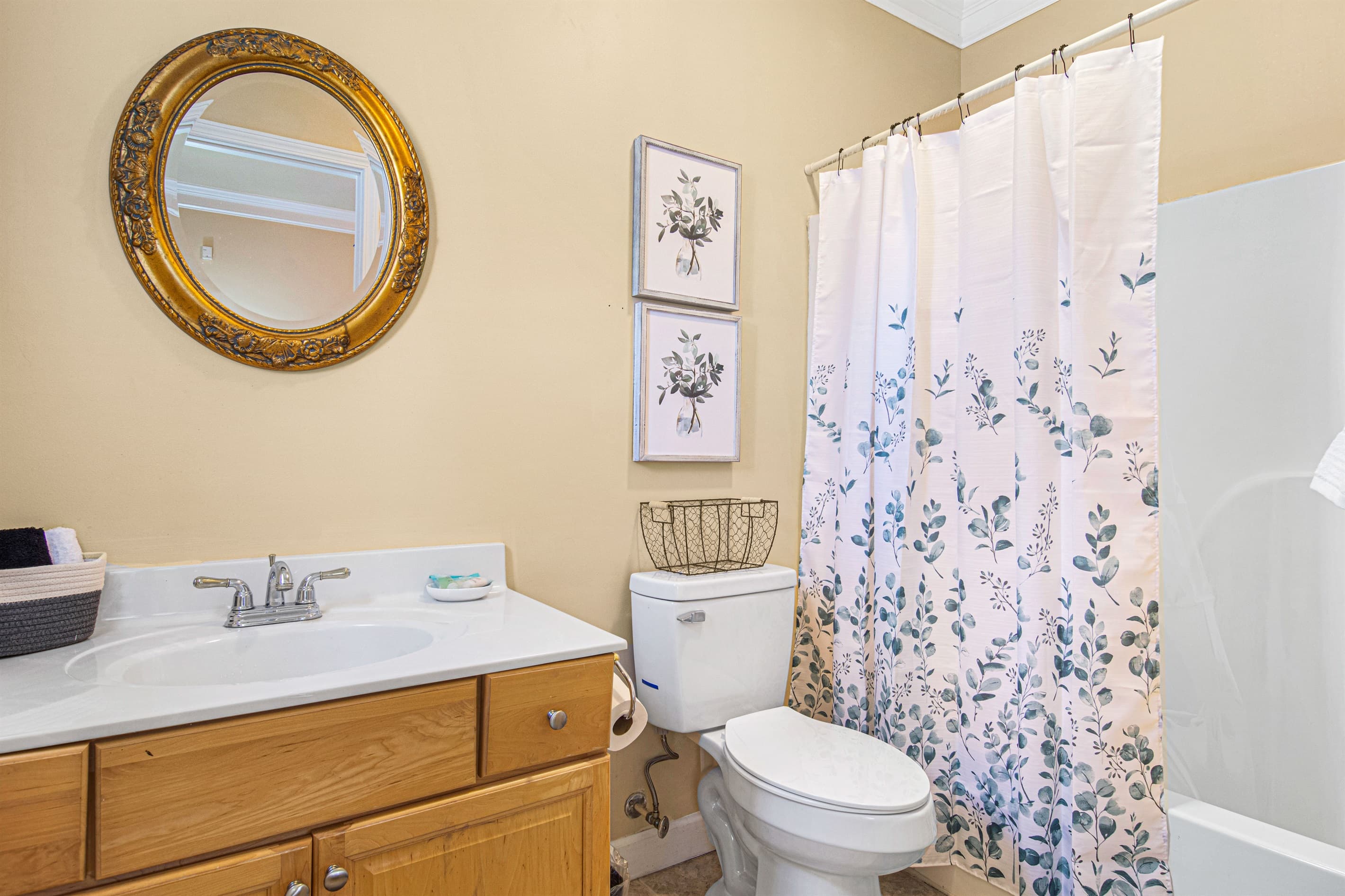 2nd bathroom on main level - Second Bathroom: Stylish floral touches and bright lighting for a refreshing retreat!