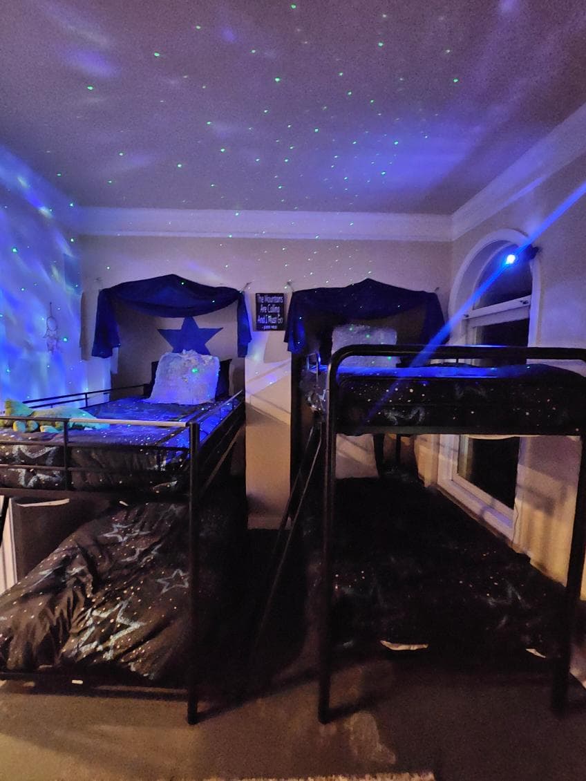 Bunk Room: Starry nights await in this futuristic space with playful lighting and fun bedding!