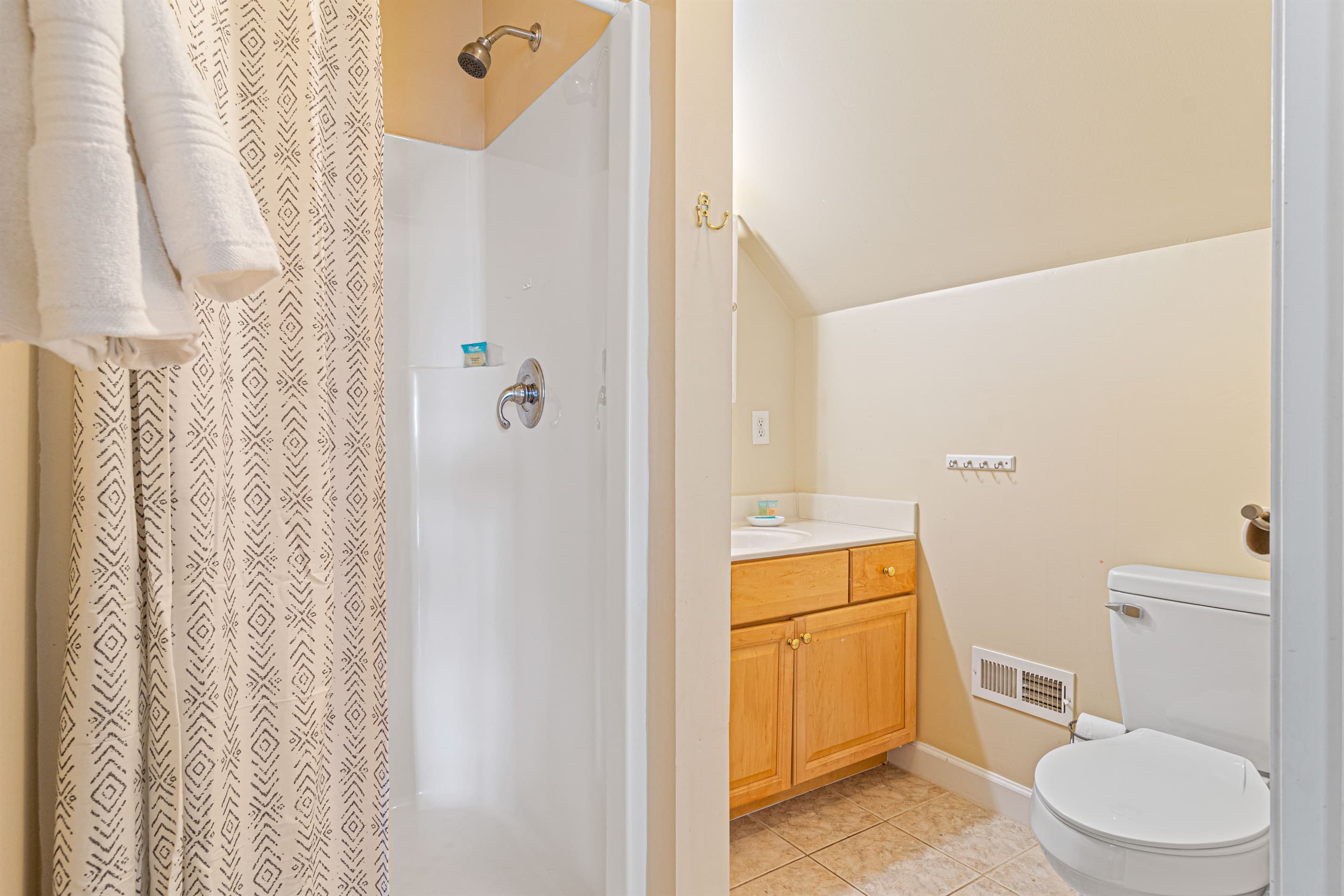 Bathroom Retreat: Bright and airy with modern fixtures and a refreshing shower for relaxation!