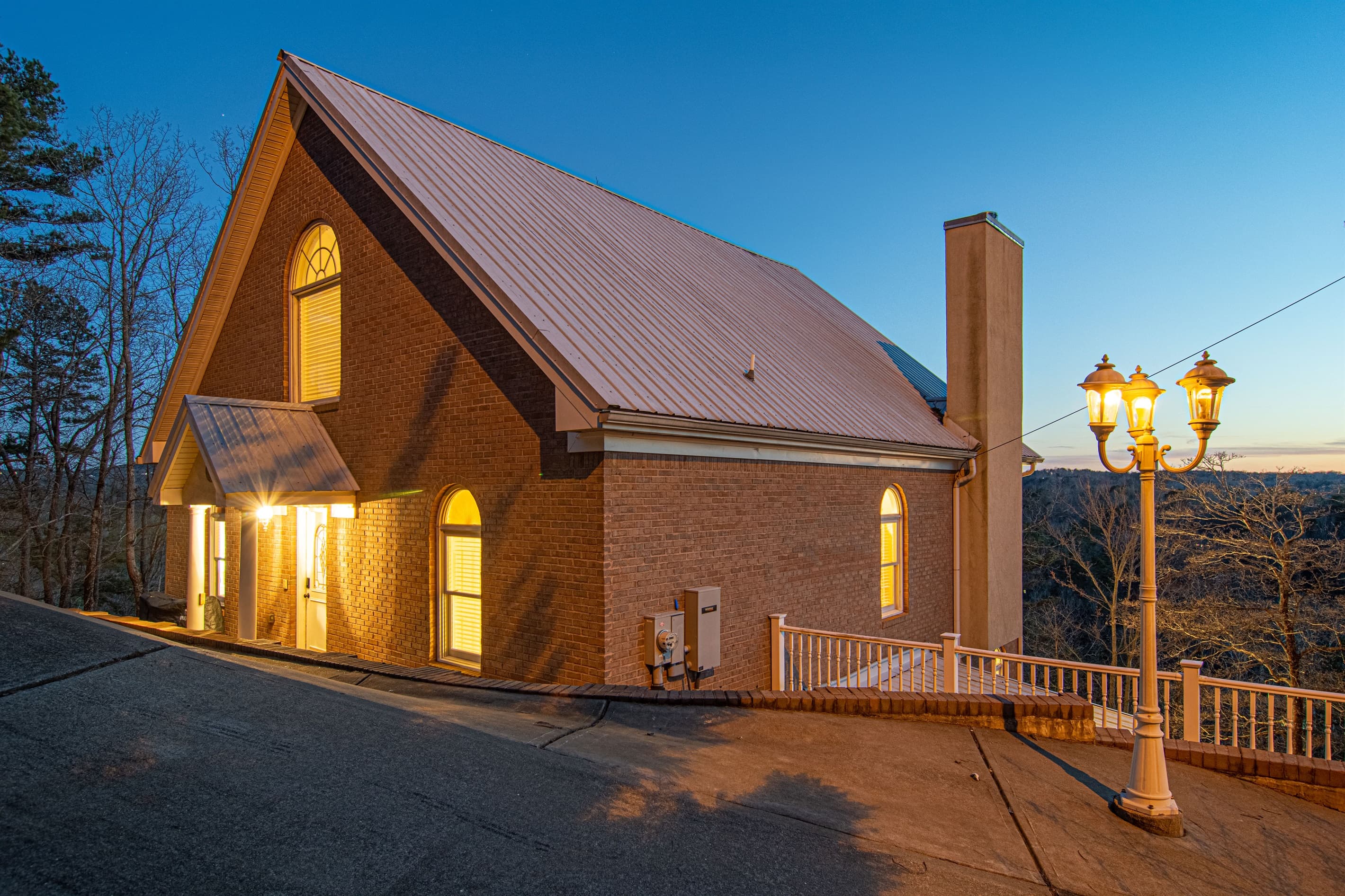 Front entrance of the home. Exterior: Elegant brick facade radiating warmth, inviting you to unwind in nature's embrace!