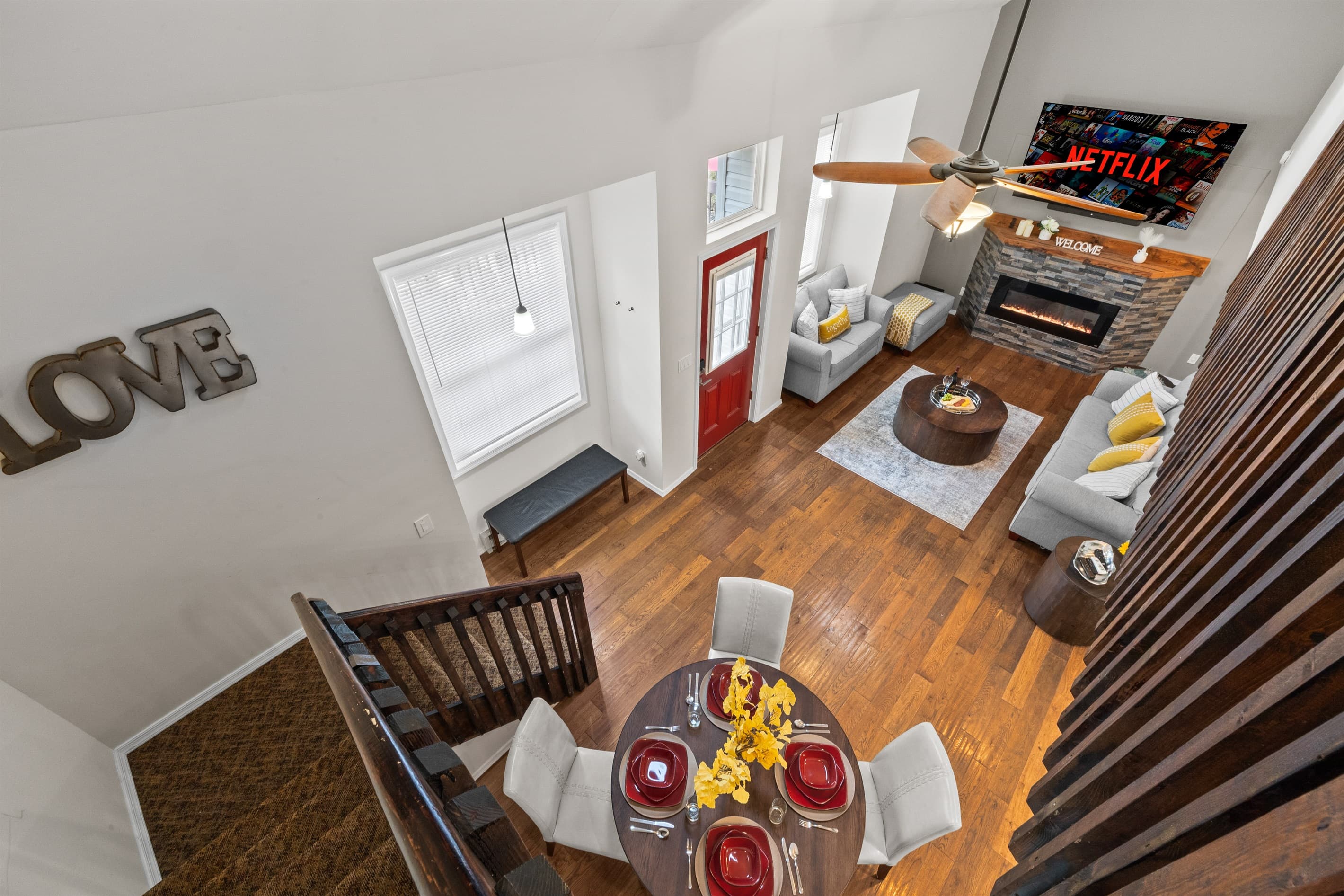 Living Room: Bright and inviting space with stylish decor, comfy seating, and a stunning fireplace!