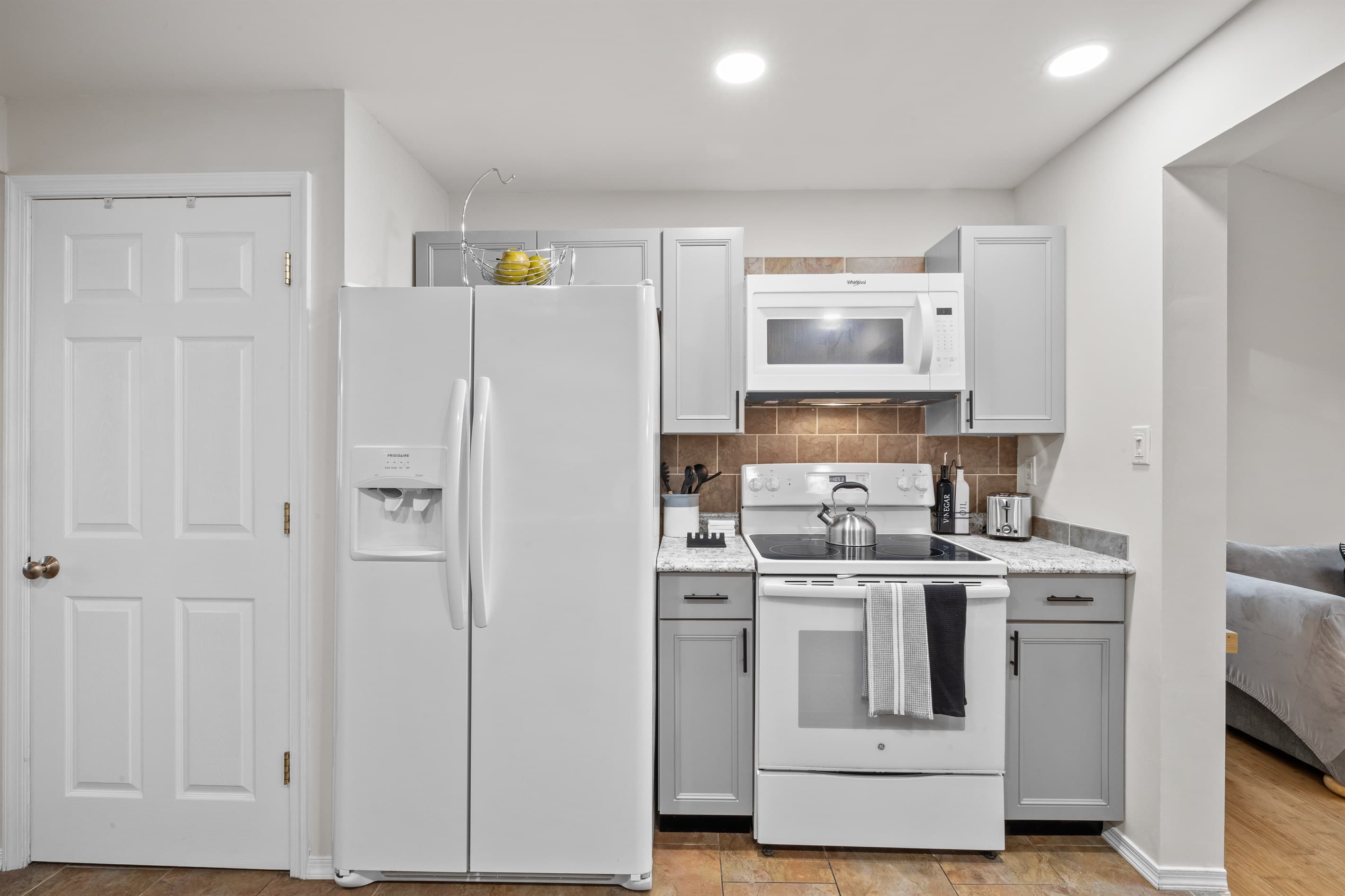 Kitchen: Cook up a feast in this stylish space with modern appliances and bright lighting!