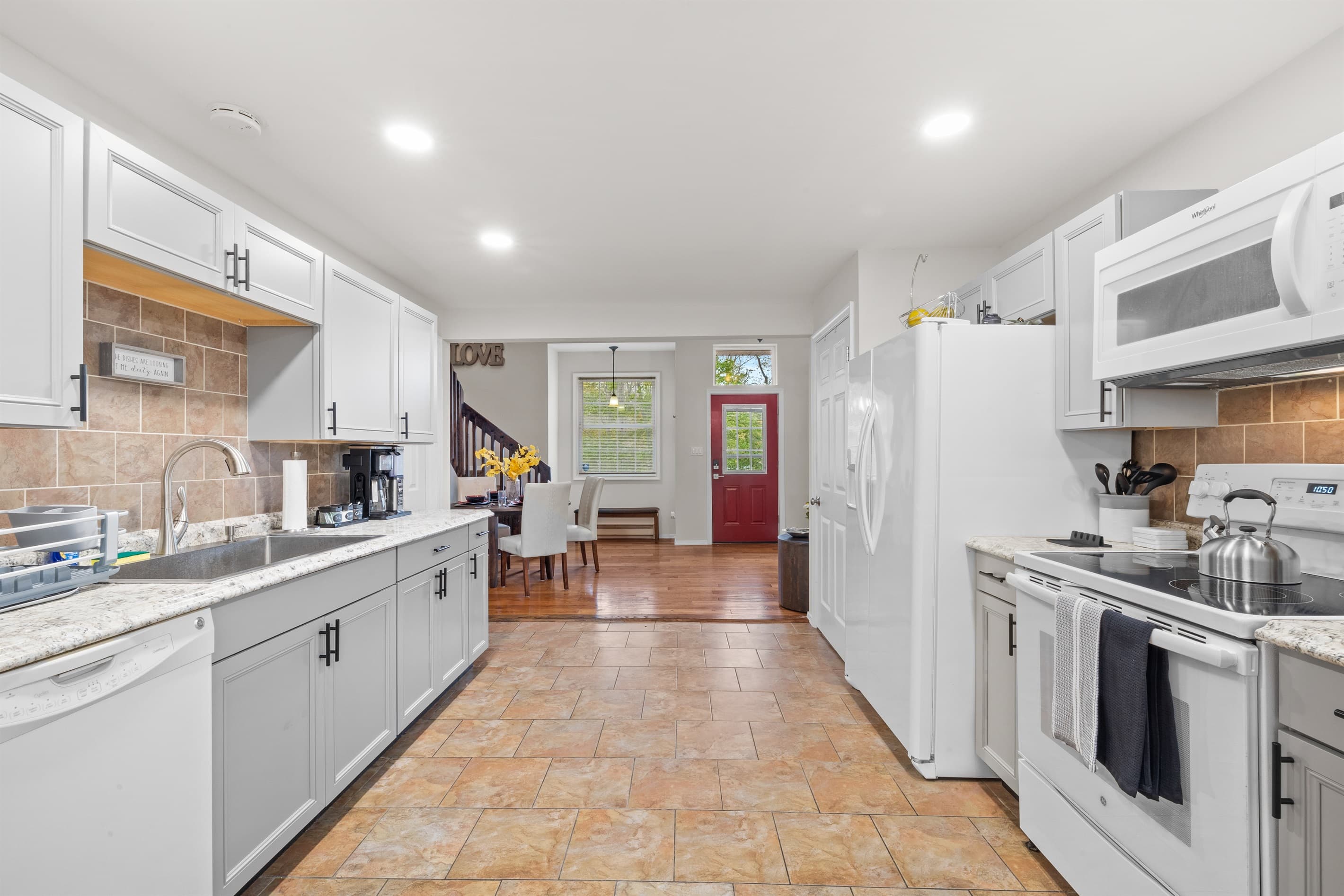 Kitchen: Modern appliances meet charming decor, perfect for culinary adventures!