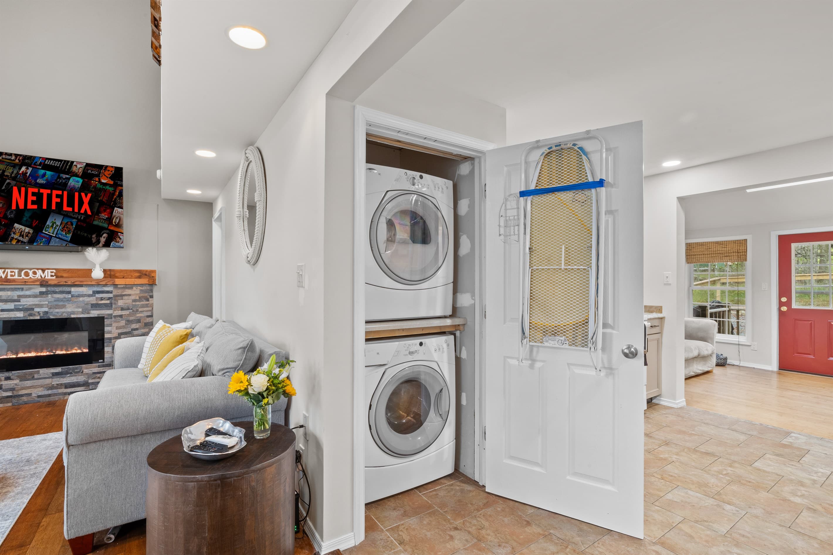 Living Room with in washer and dryer