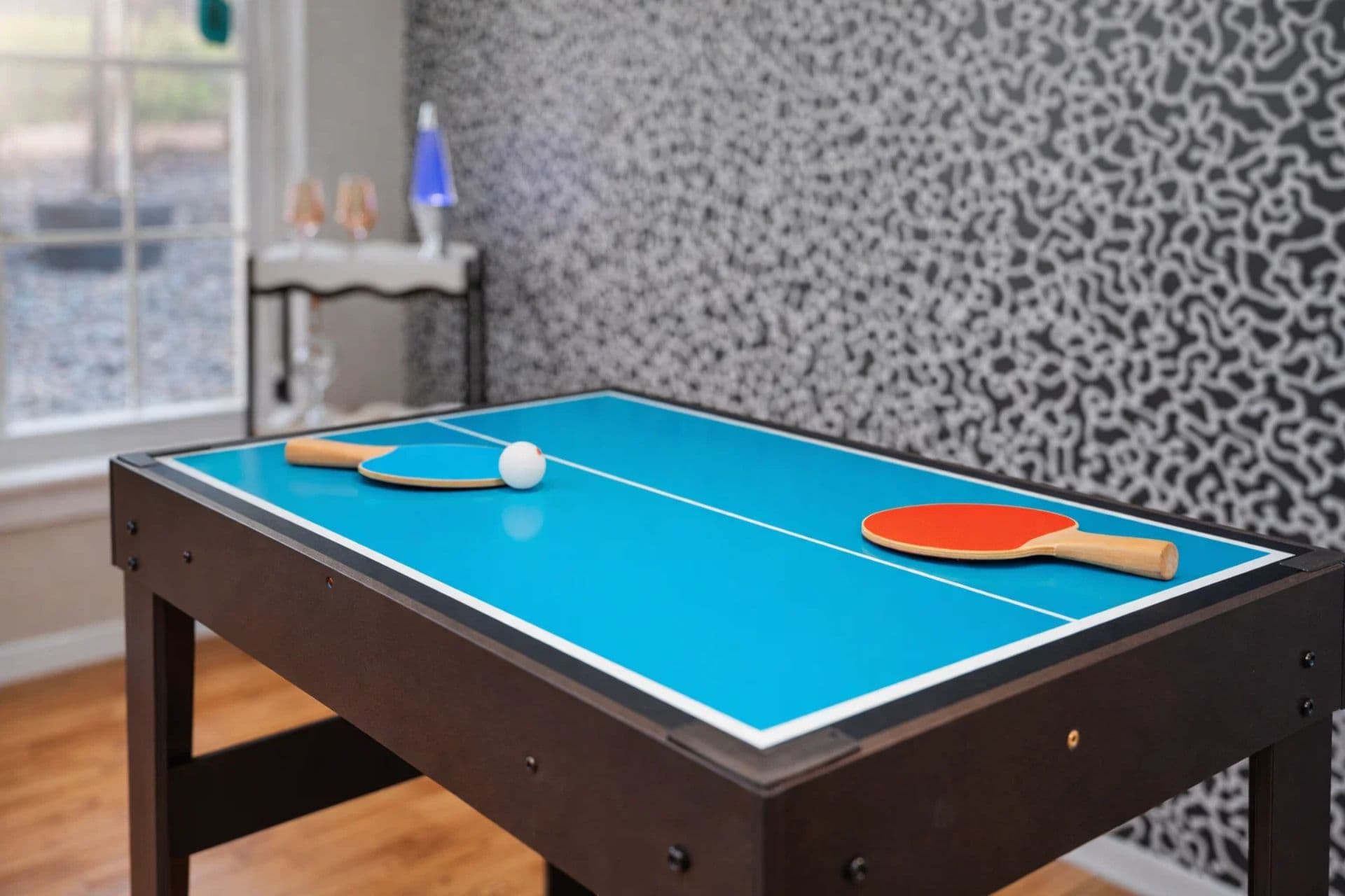 Game Room: Dive into fun with this vibrant ping-pong table and lively decor!