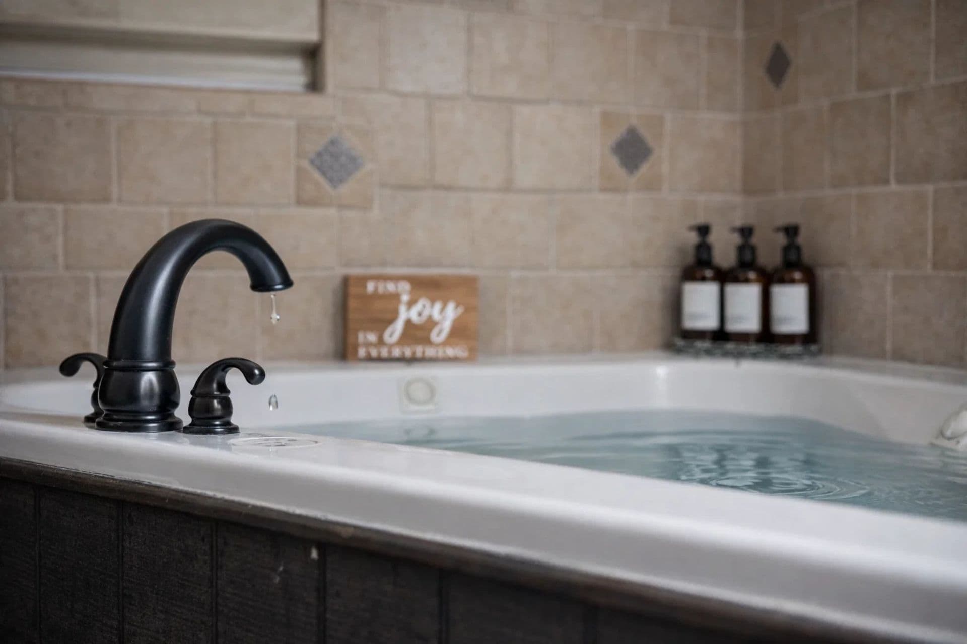 Master Bathroom: Indulge in a relaxing soak with luxury bath products and elegant tile accents!