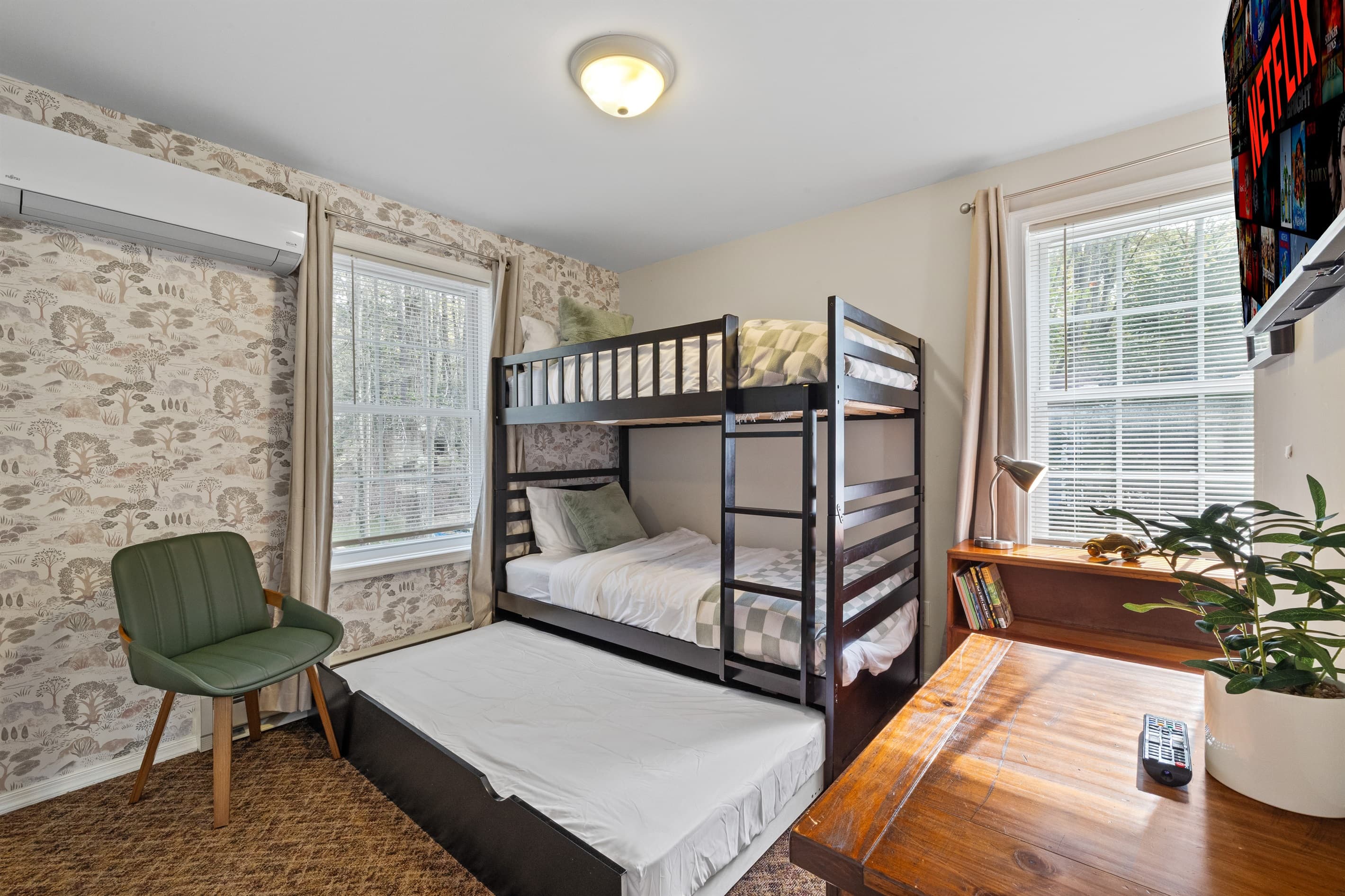 Bunk Room: Fun and functional with a stylish bunk bed, desk, and fresh natural light!
