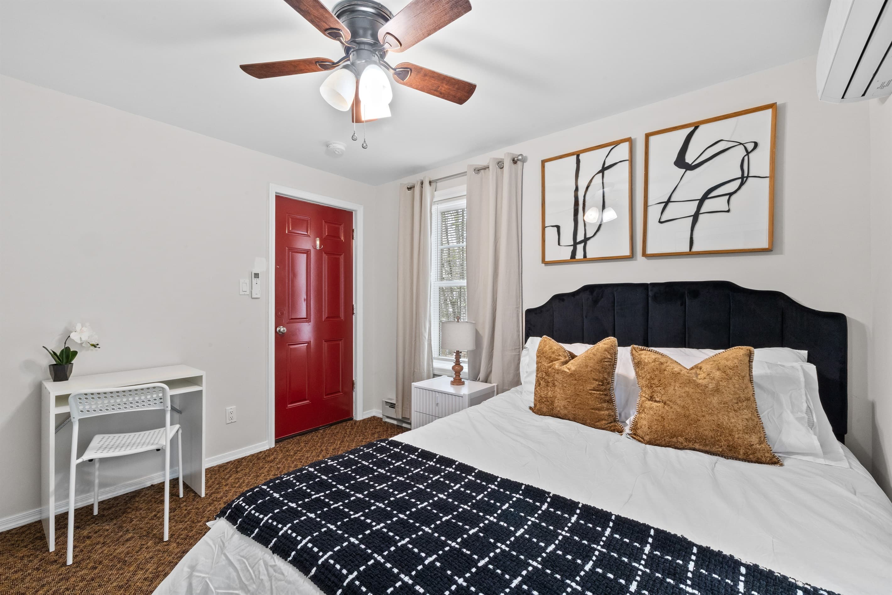 Bedroom Retreat: Elegant furnishings and vibrant decor create a serene haven for relaxation!