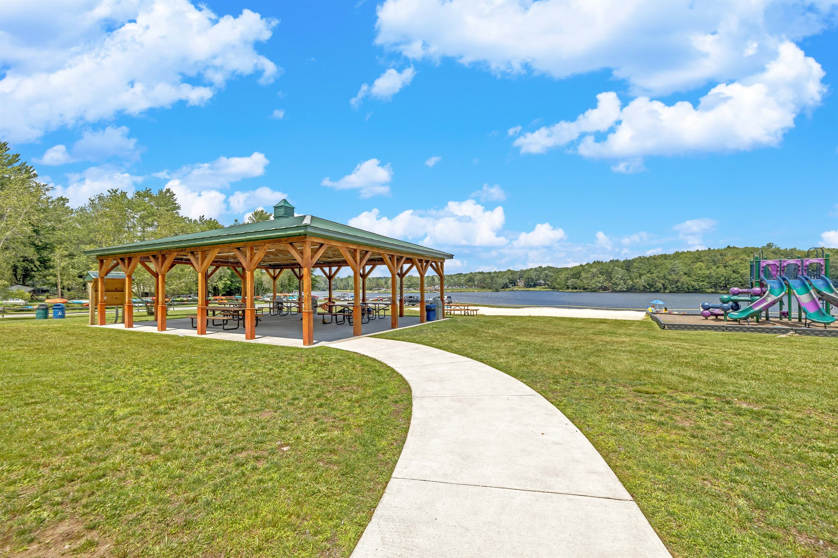 Picnic Pavilion: Gather friends and family by the lake under this charming wooden structure!