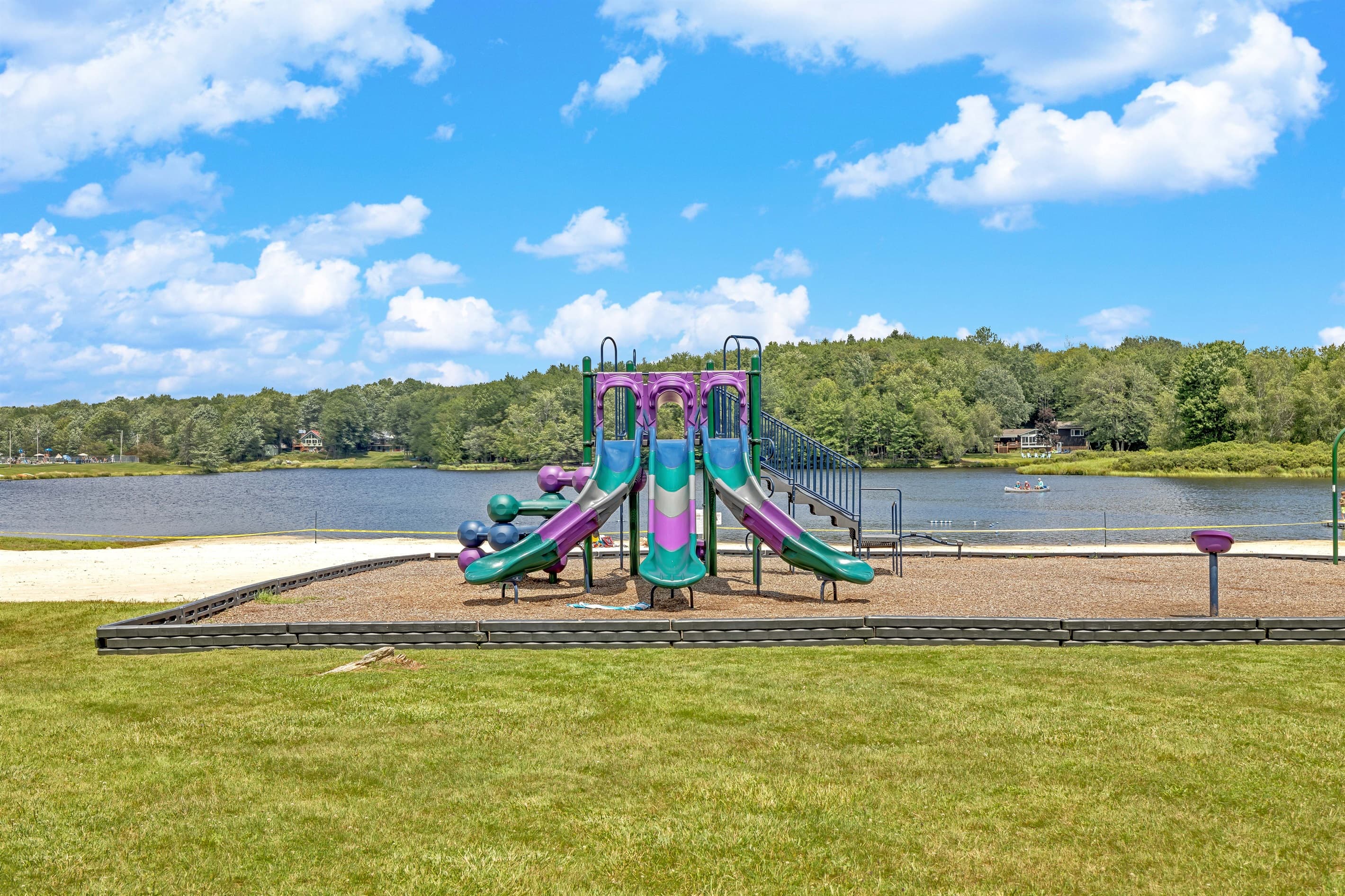 Playground Paradise: Adventure awaits with slides and scenic lake views for fun-filled days!