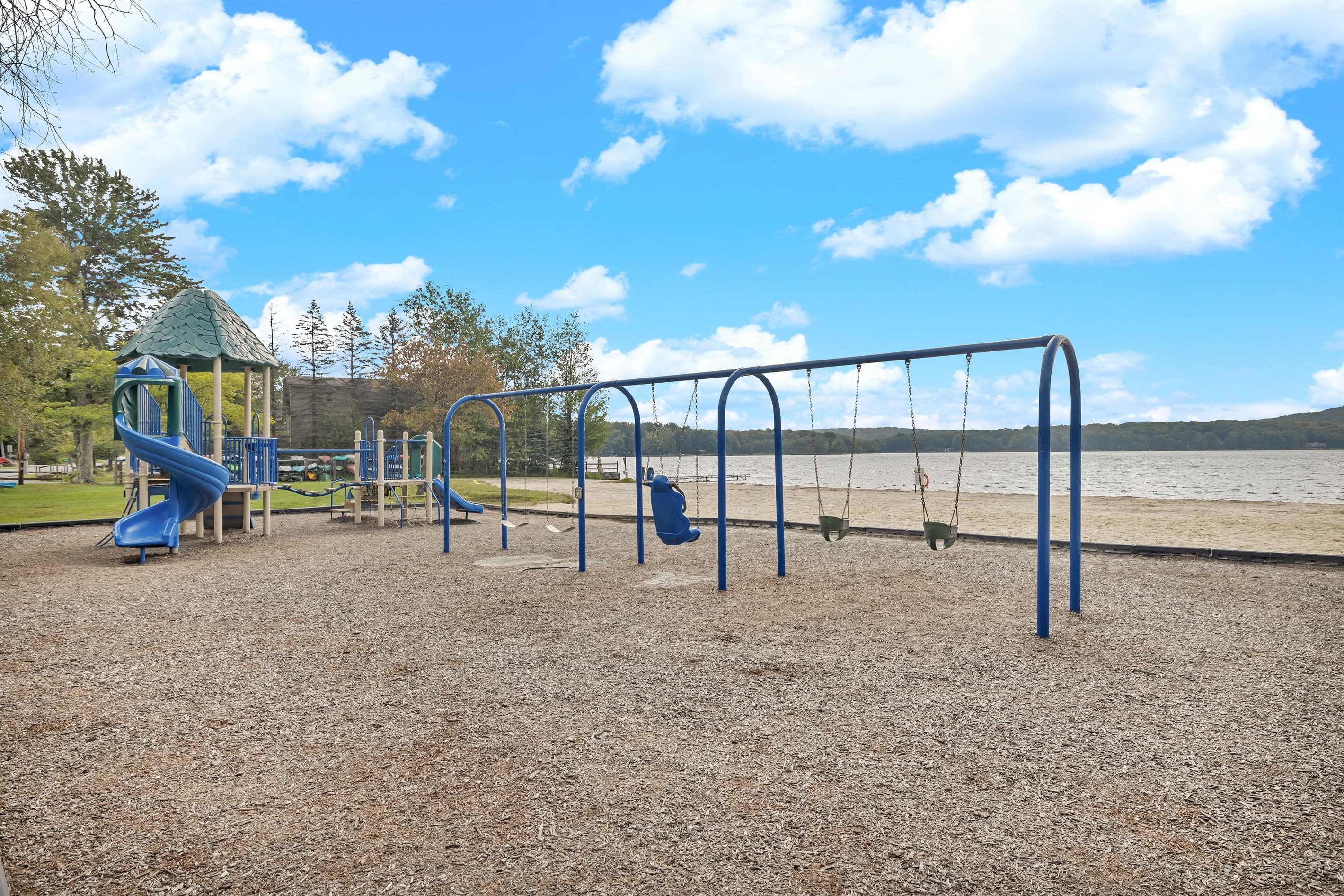 Playground Paradise: Fun-filled days await at this scenic lakeside playground!