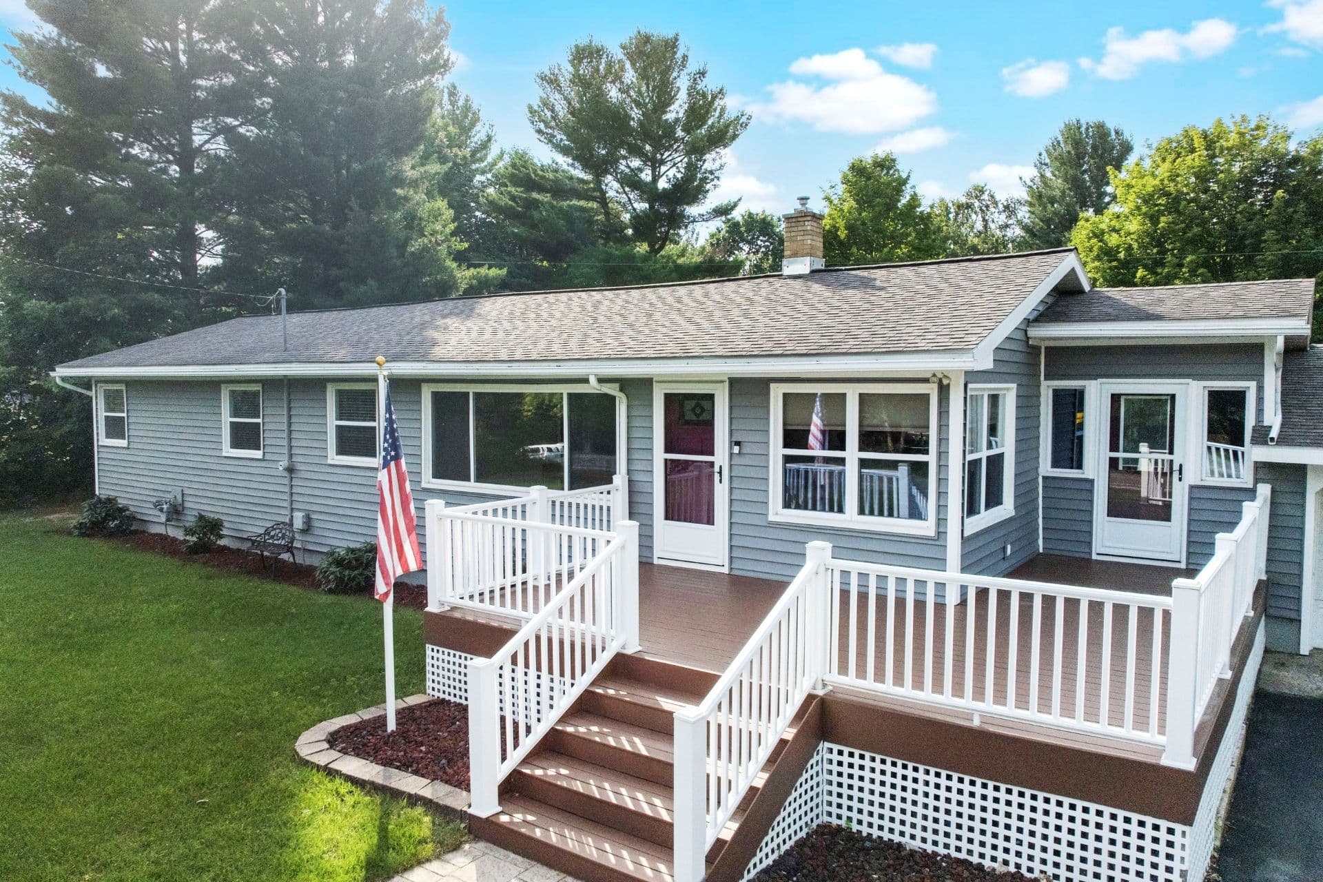 Welcoming Entrance: Step onto the stylish deck and into your Traverse City getaway adventure!