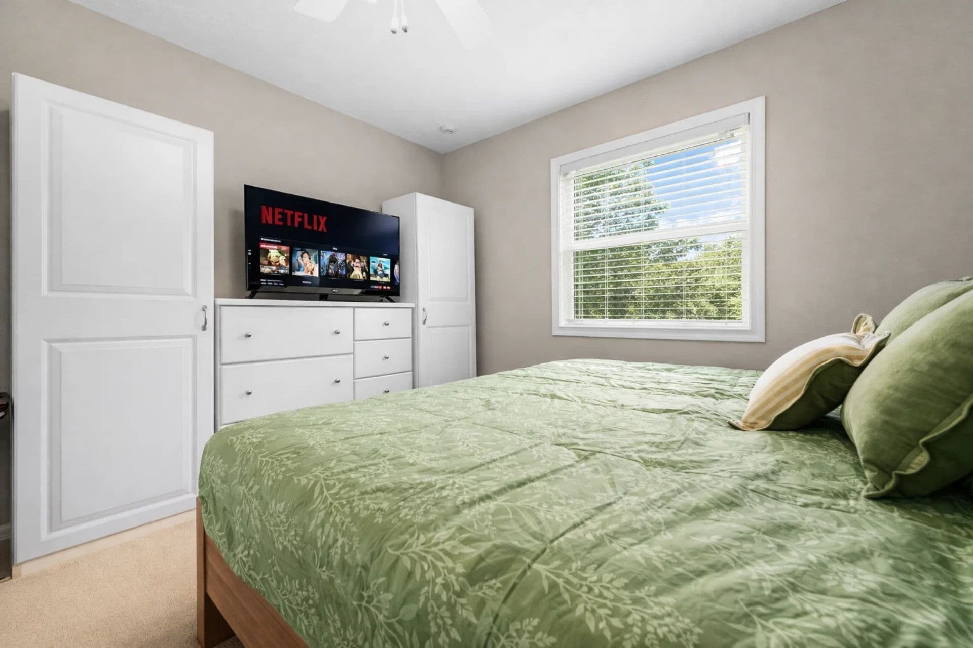 2nd bedroom with king bed and TV