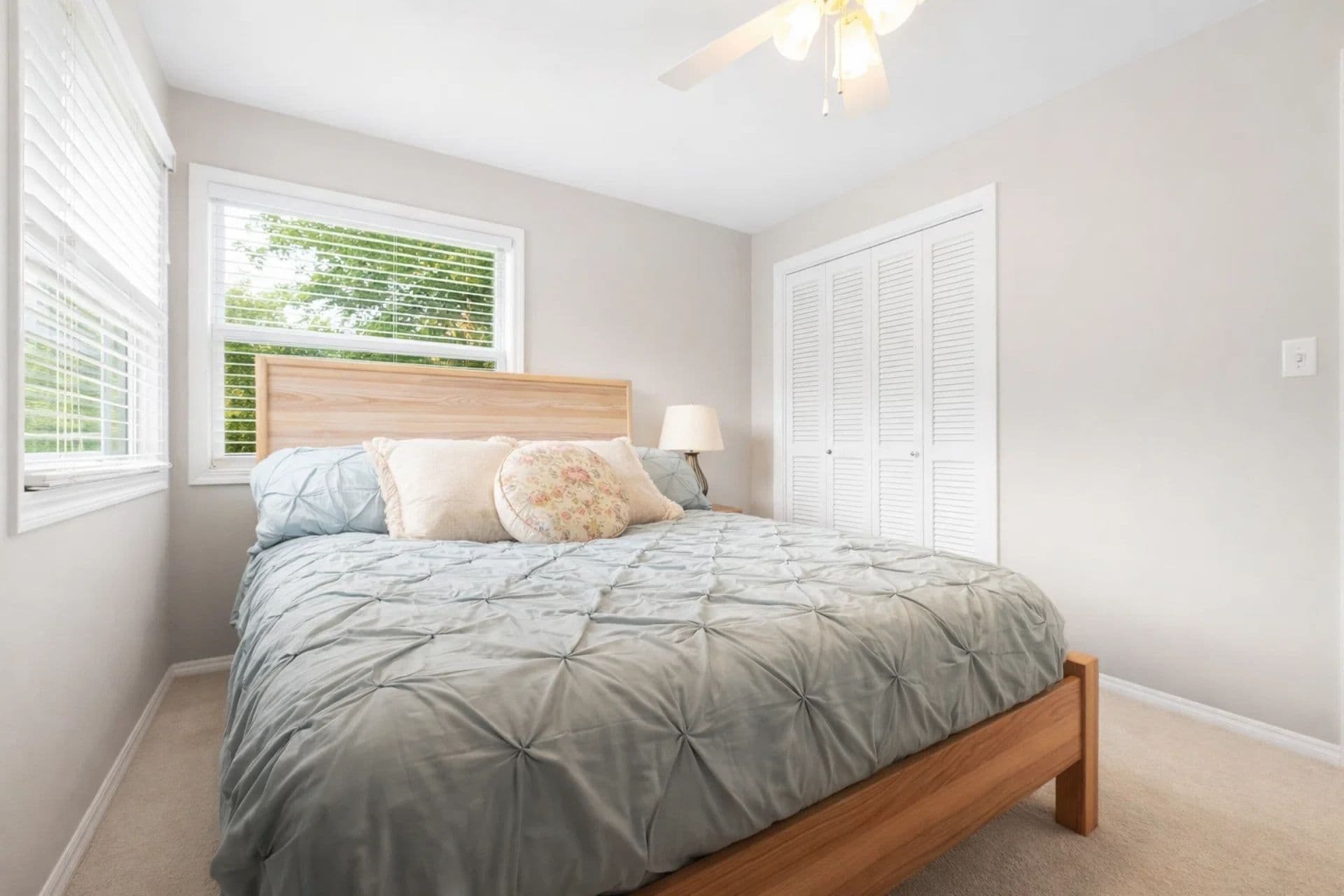 Cozy third bedroom featuring a comfortable queen -sized bed, perfect for a peaceful night's sleep