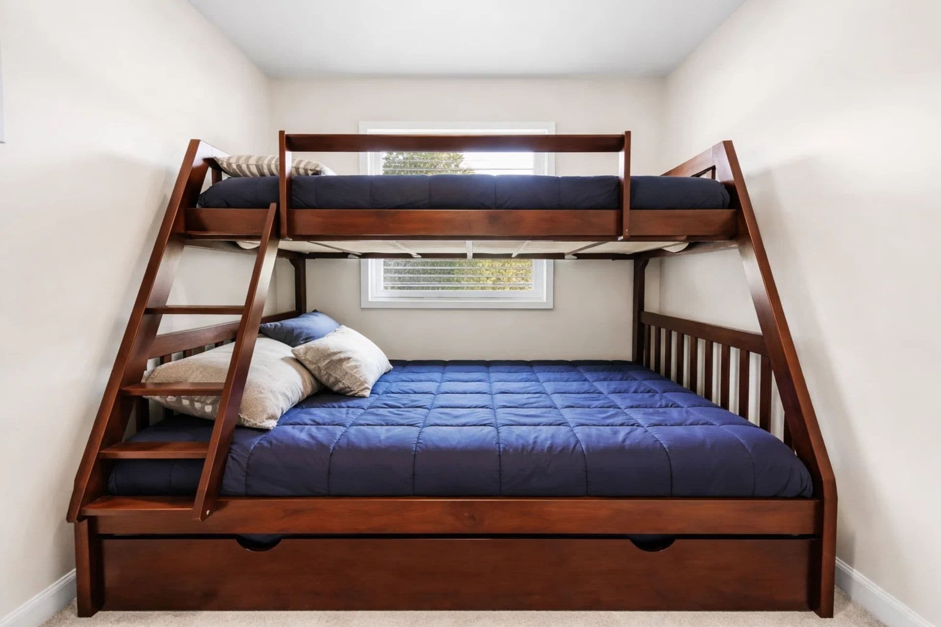 Charming 4th bedroom with a twin-over-full bunk bed and a convenient trundle, ideal for maximizing space and accommodating extra guests