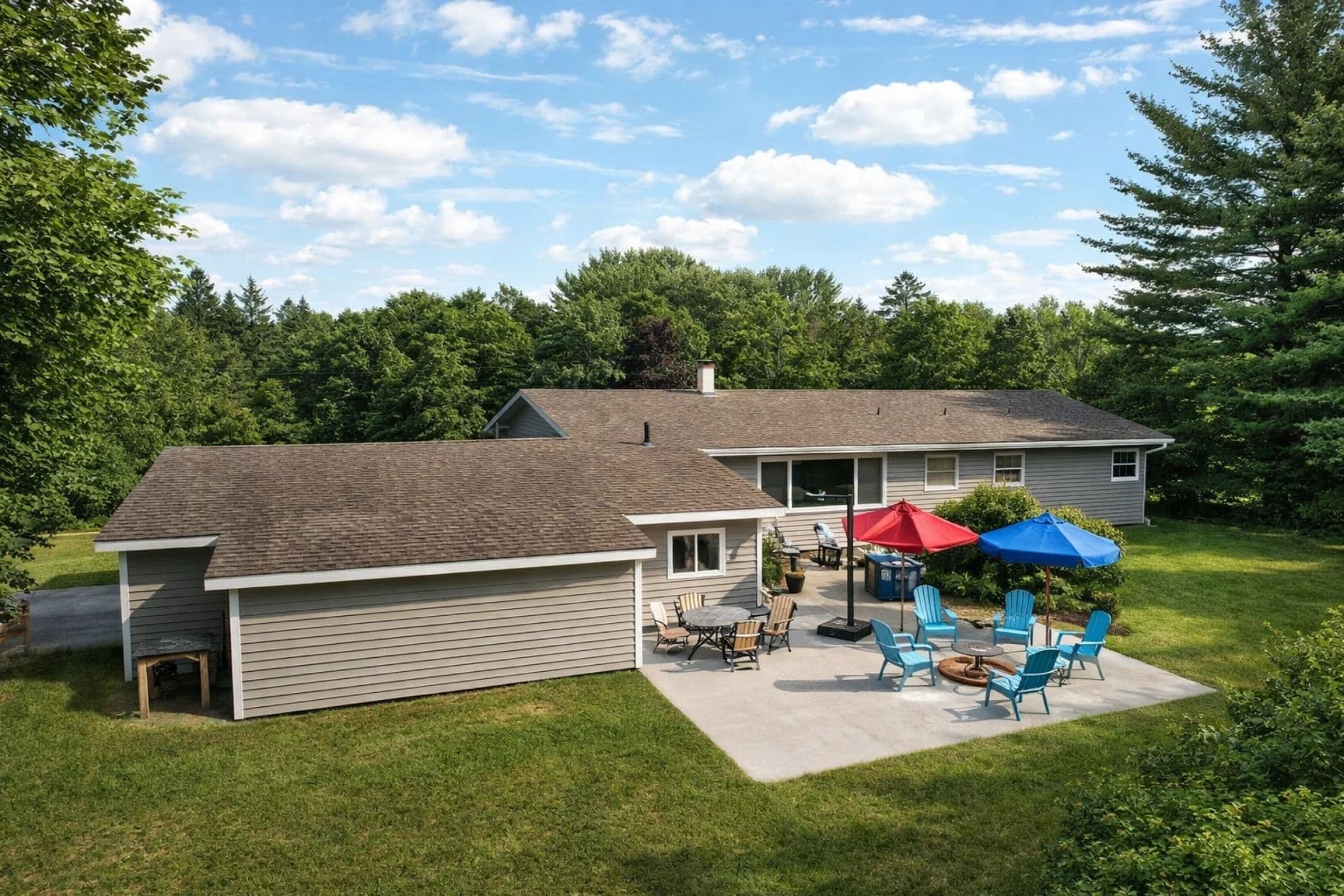 Relaxing backyard complete with comfortable seating an a cozy firepit, perfect for enjoying your evenings