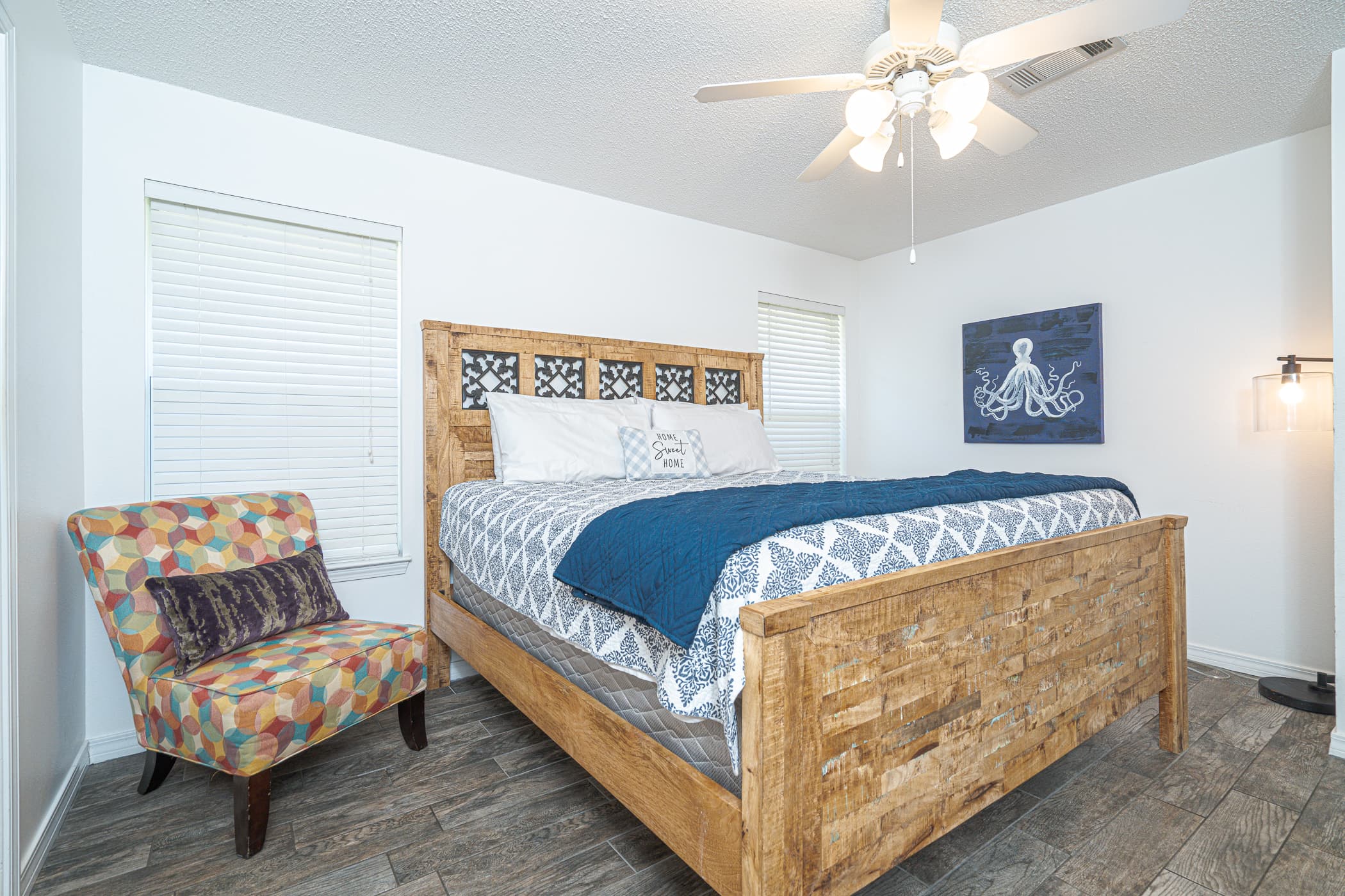Main Bedroom: Elegant king bed with charming decor and natural light—perfect for relaxation!
