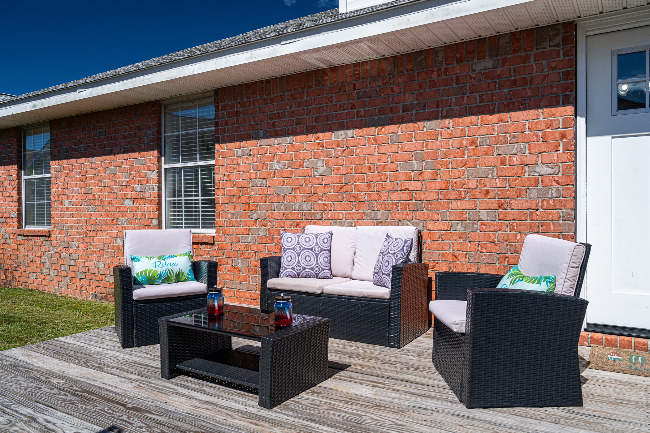 Outdoor Lounge: Sip cocktails in style on this charming patio with inviting seating!
