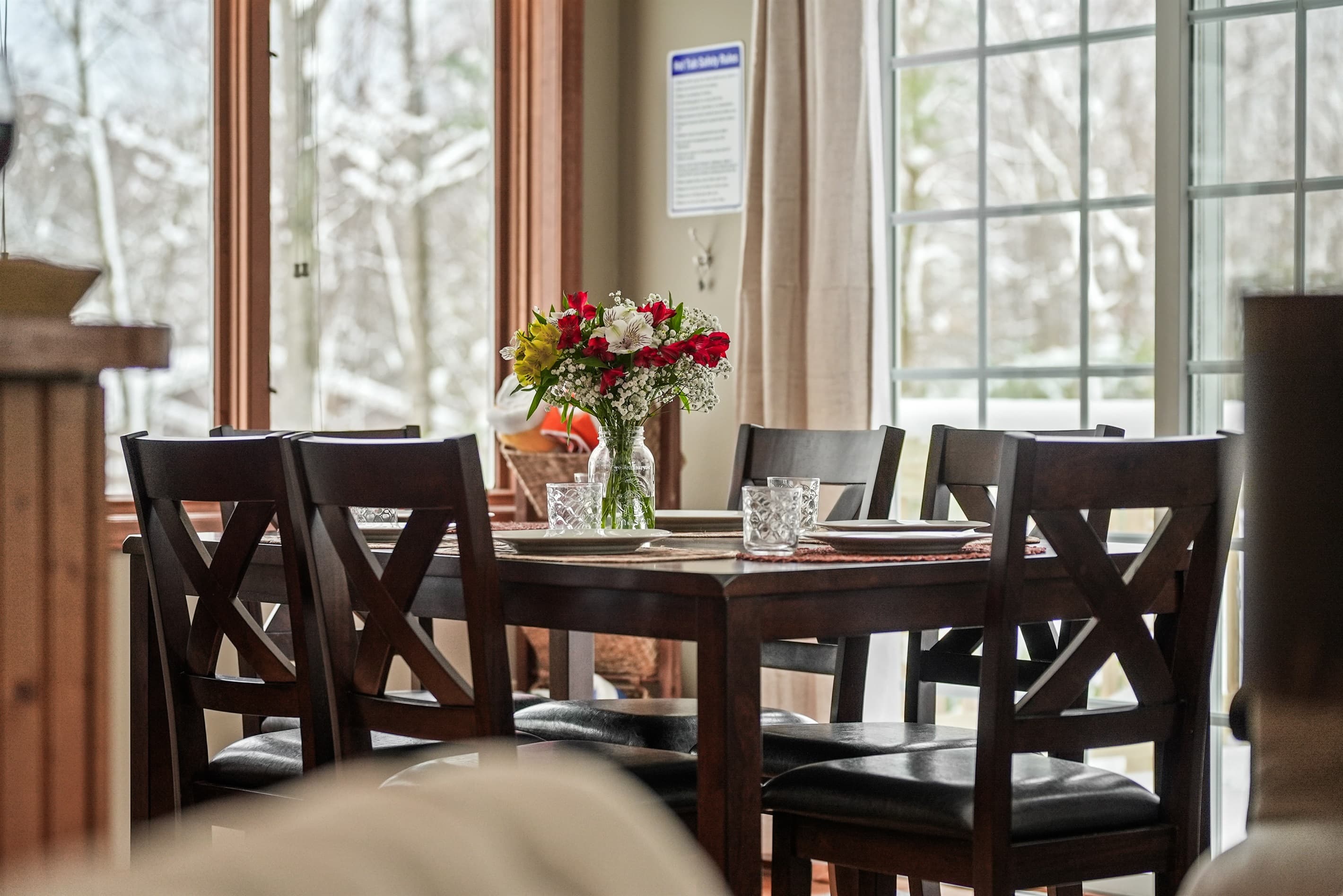 Dining Room: Gather around the elegantly set table and savor scenic views of winter wonderland!