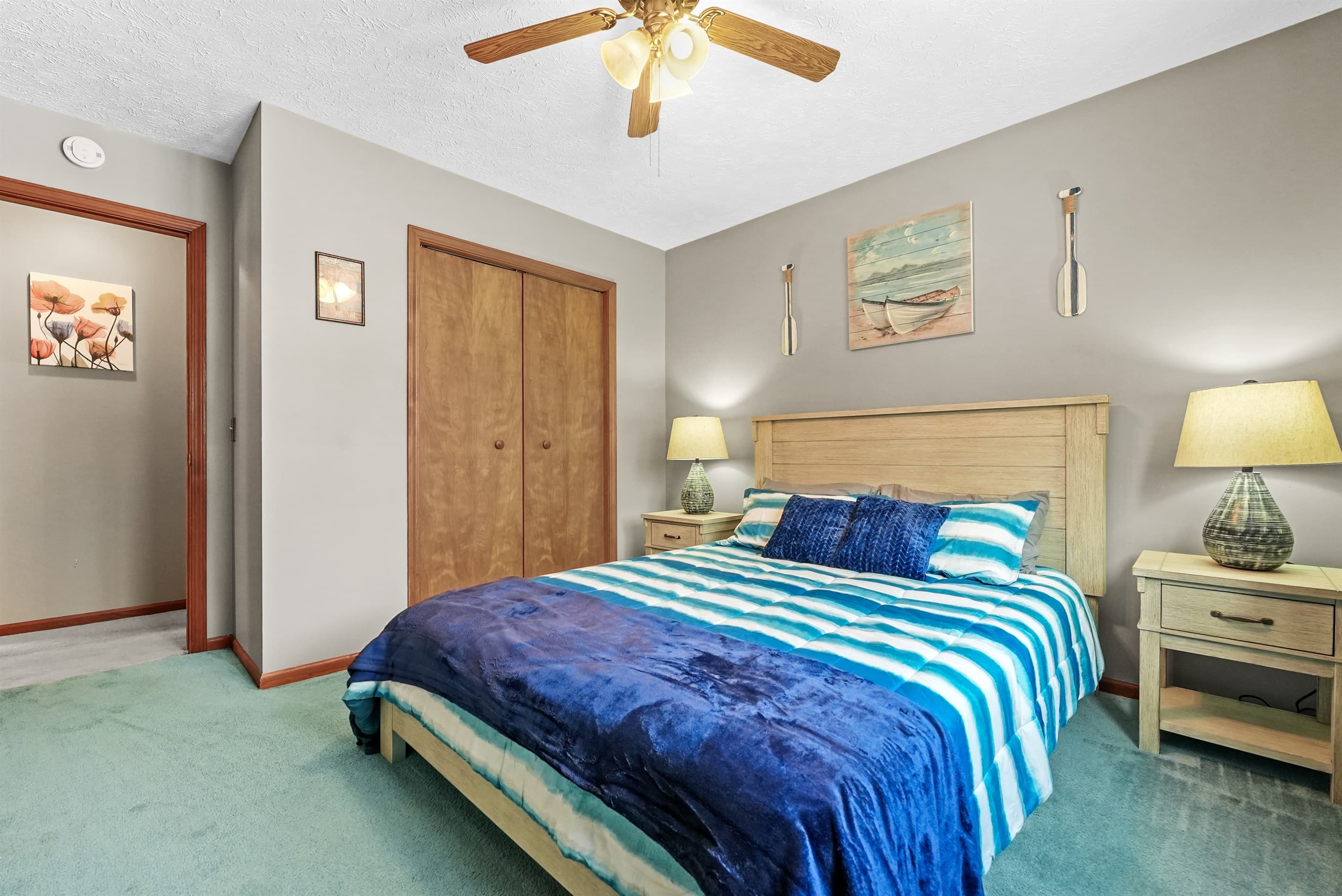4th Bedroom: Beachy vibes await in this stylish room with calming decor and vibrant hues!
