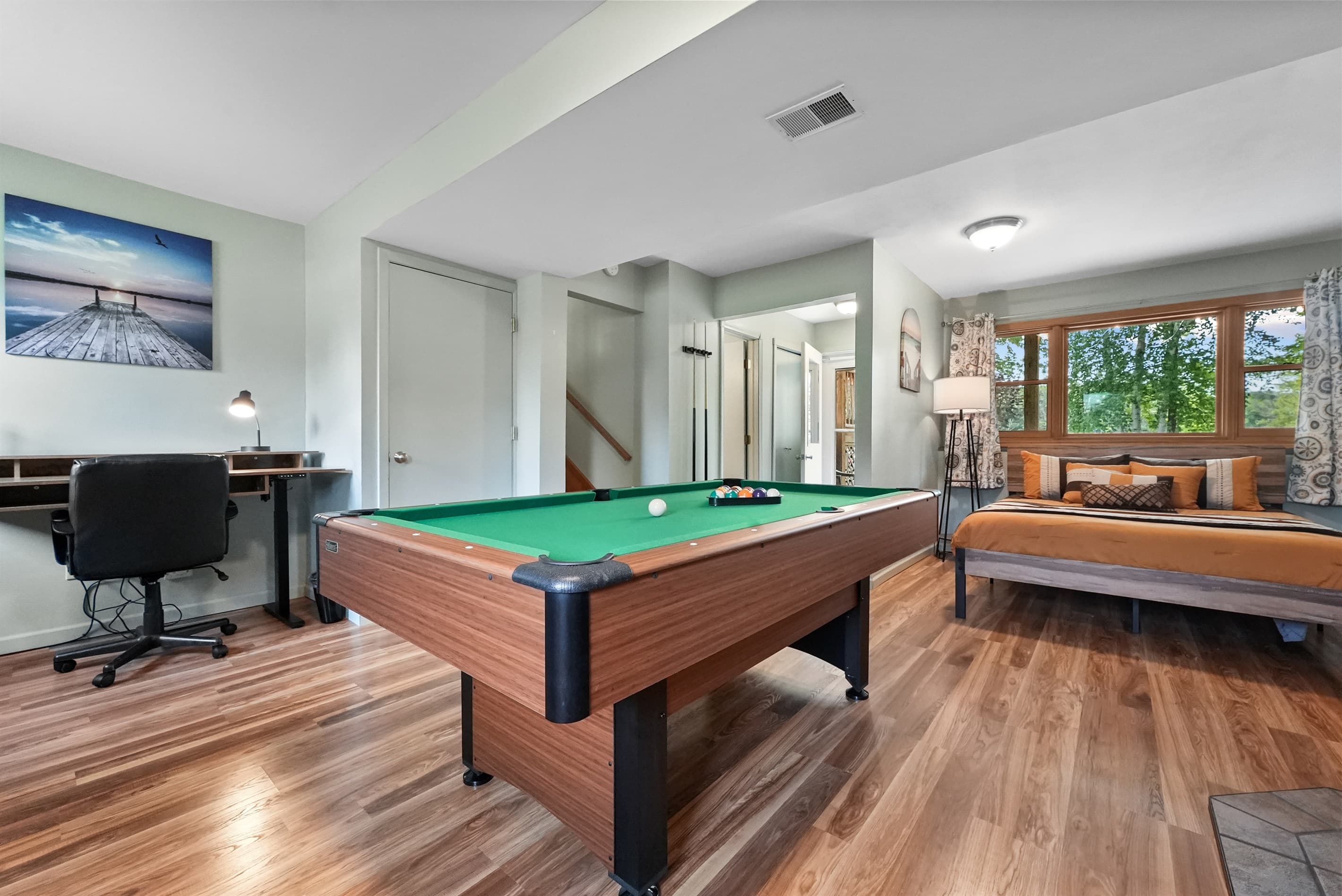 Game Room Oasis: Enjoy friendly competition with pool and bright natural light streaming in!